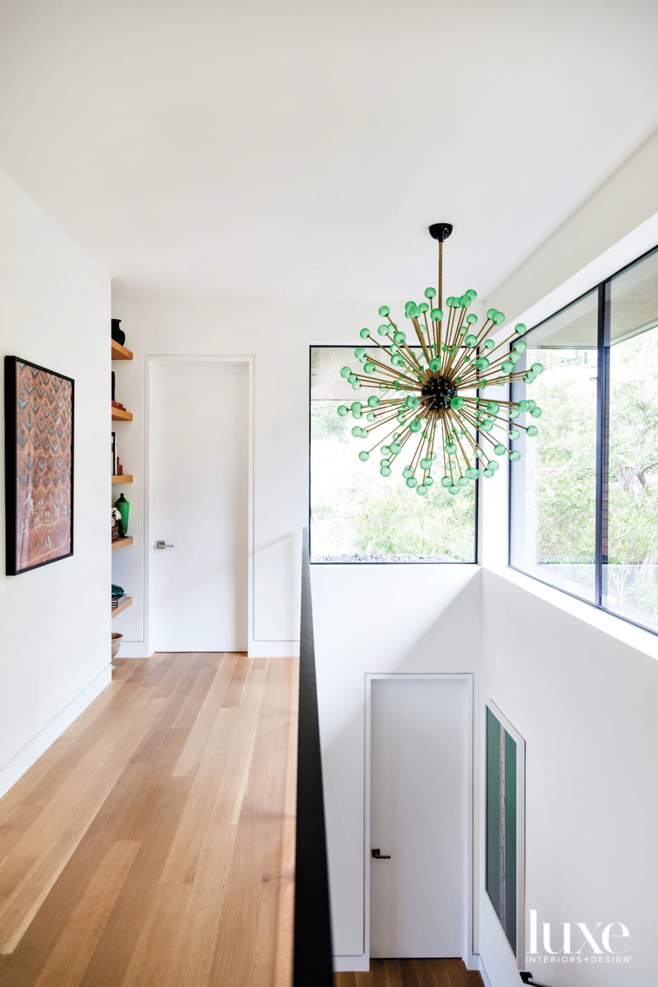 interior stairway with green-glass sputnik light fixture