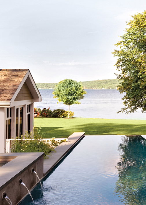 lake house exterior with pool