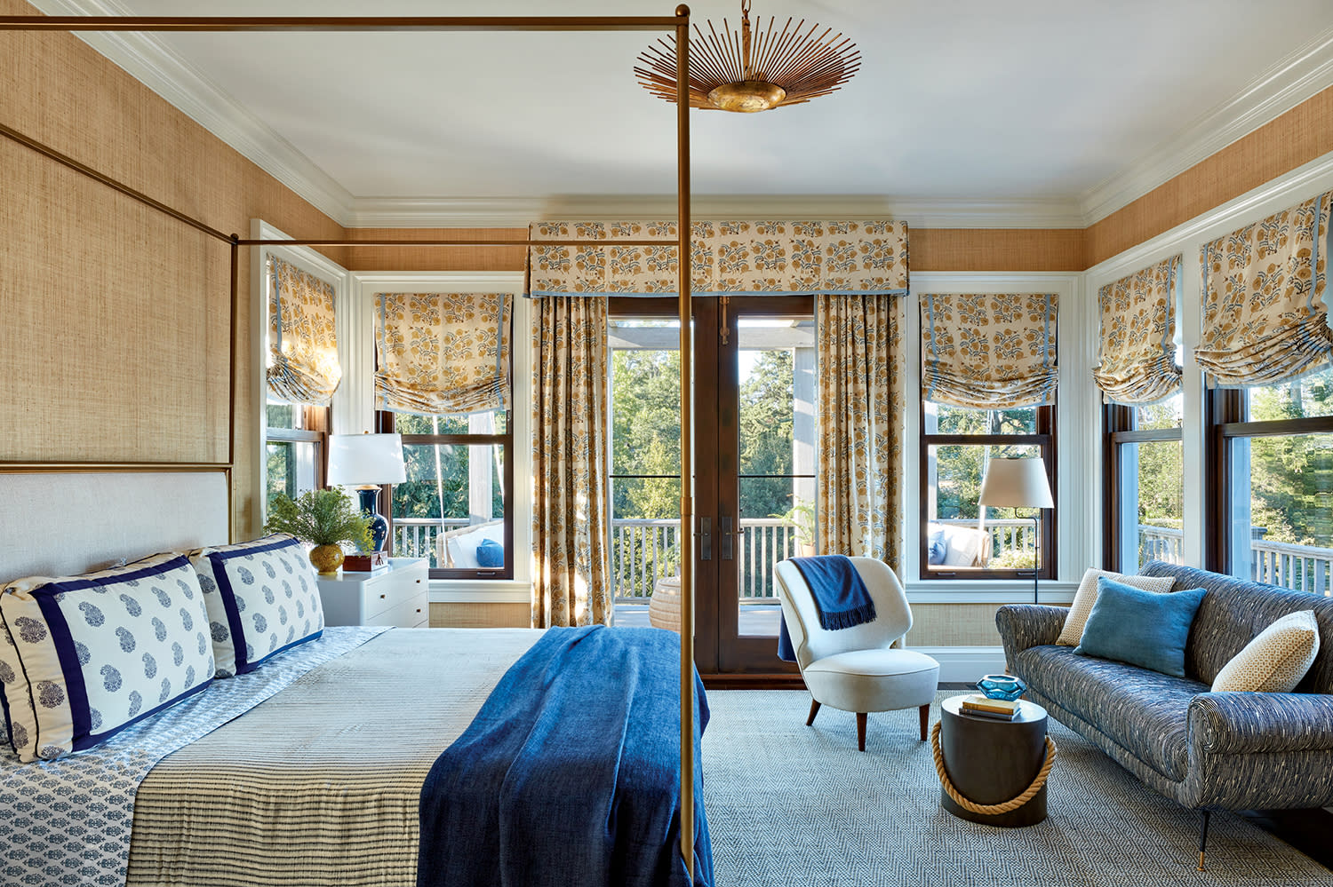 guest bedroom with a sandy grasscloth wallcovering and sunburst lighting fixture on the ceiling