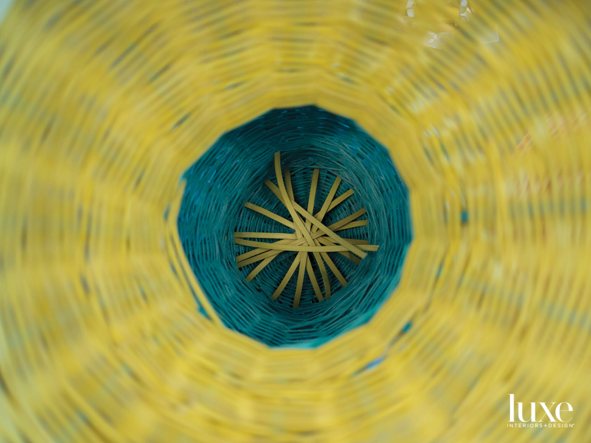 The interior of a blue and yellow basket.