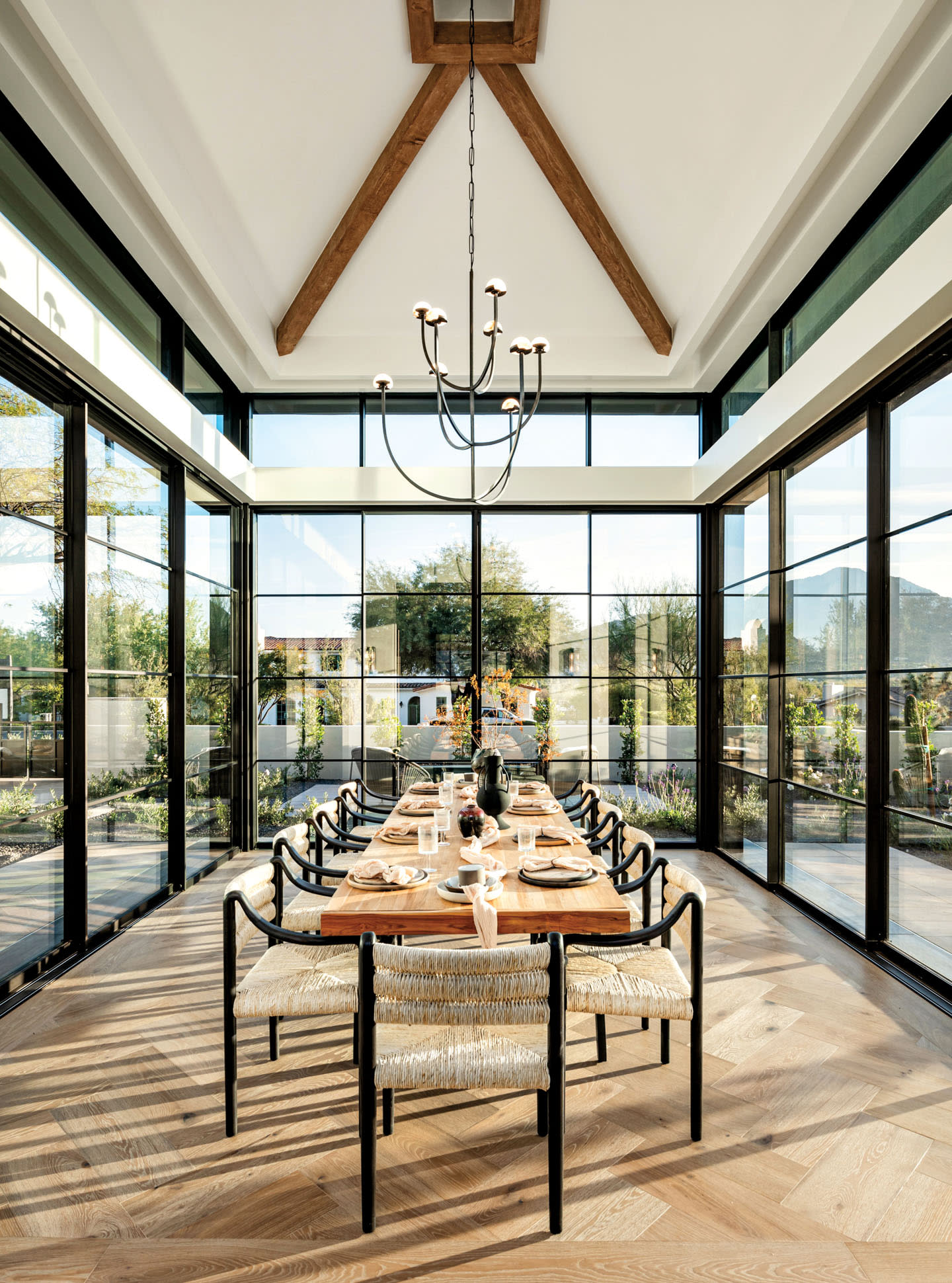 bright dining room surrounded by glass walls