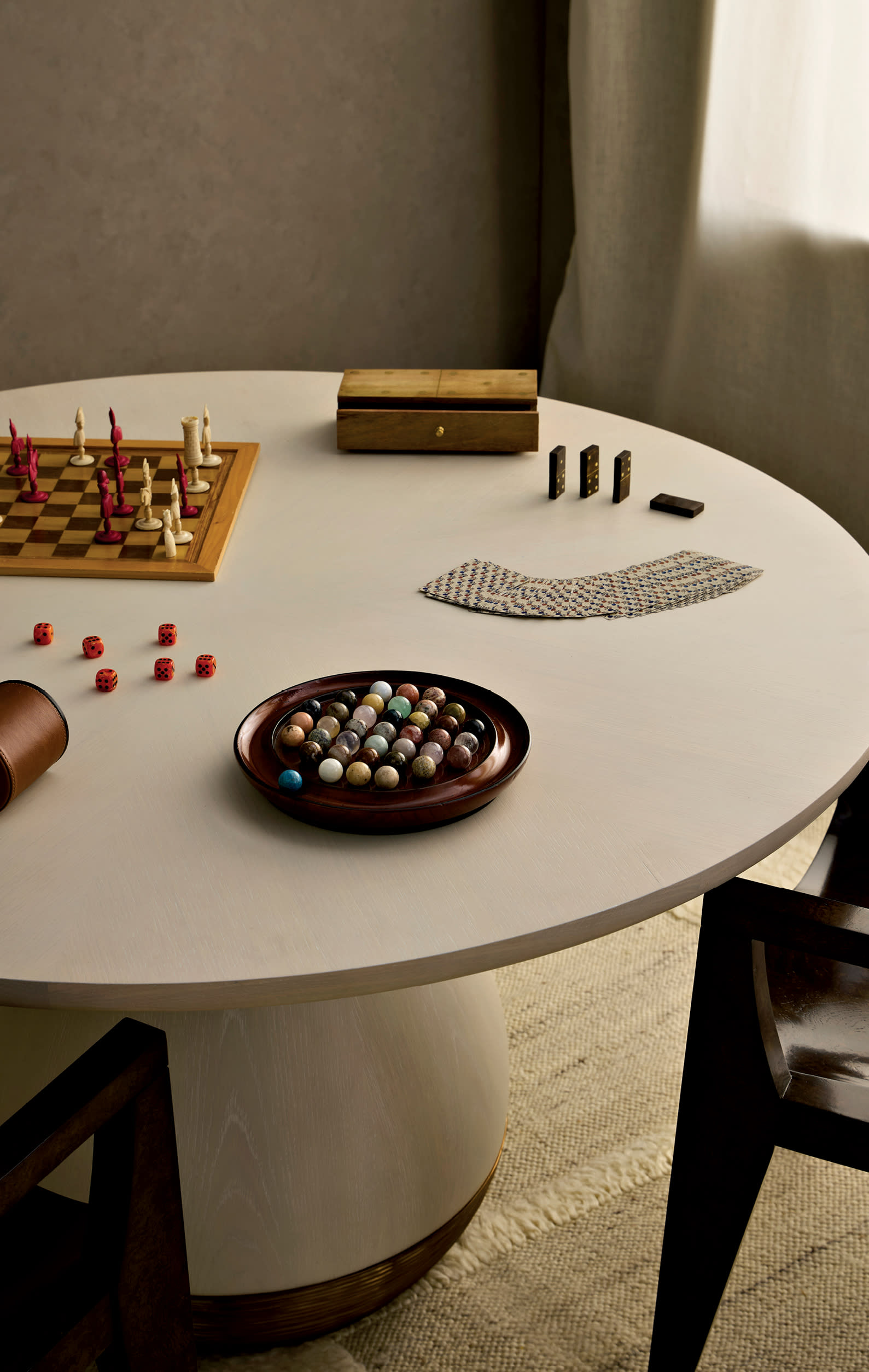 round white table with board games atop it 