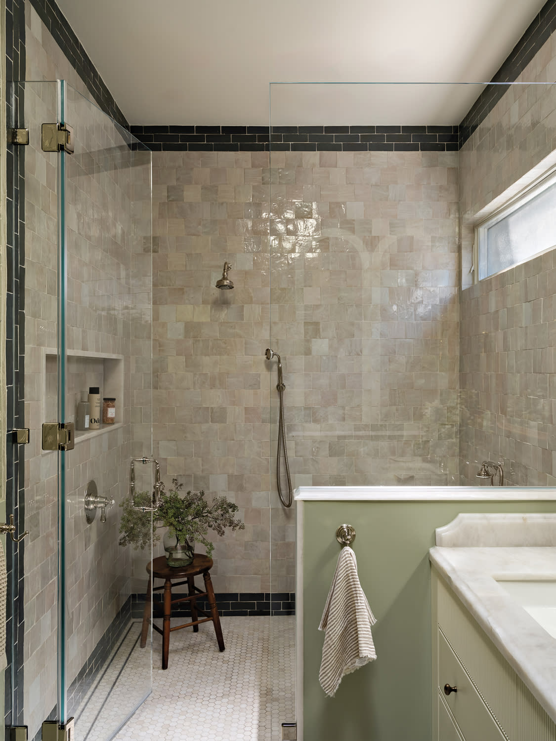 modern bathroom with zellige tiles surrounding the shower