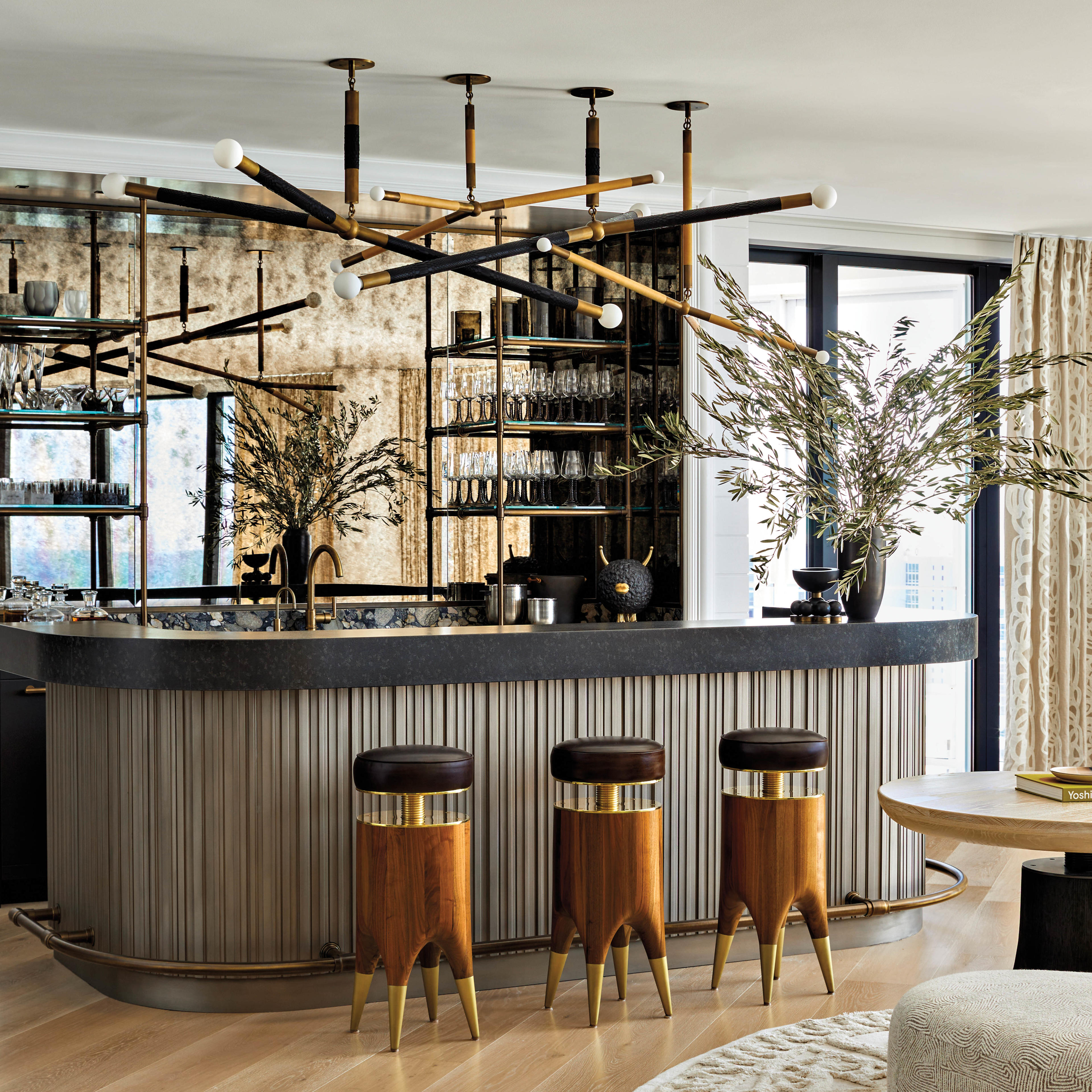 modern great room bar with a dark color palette