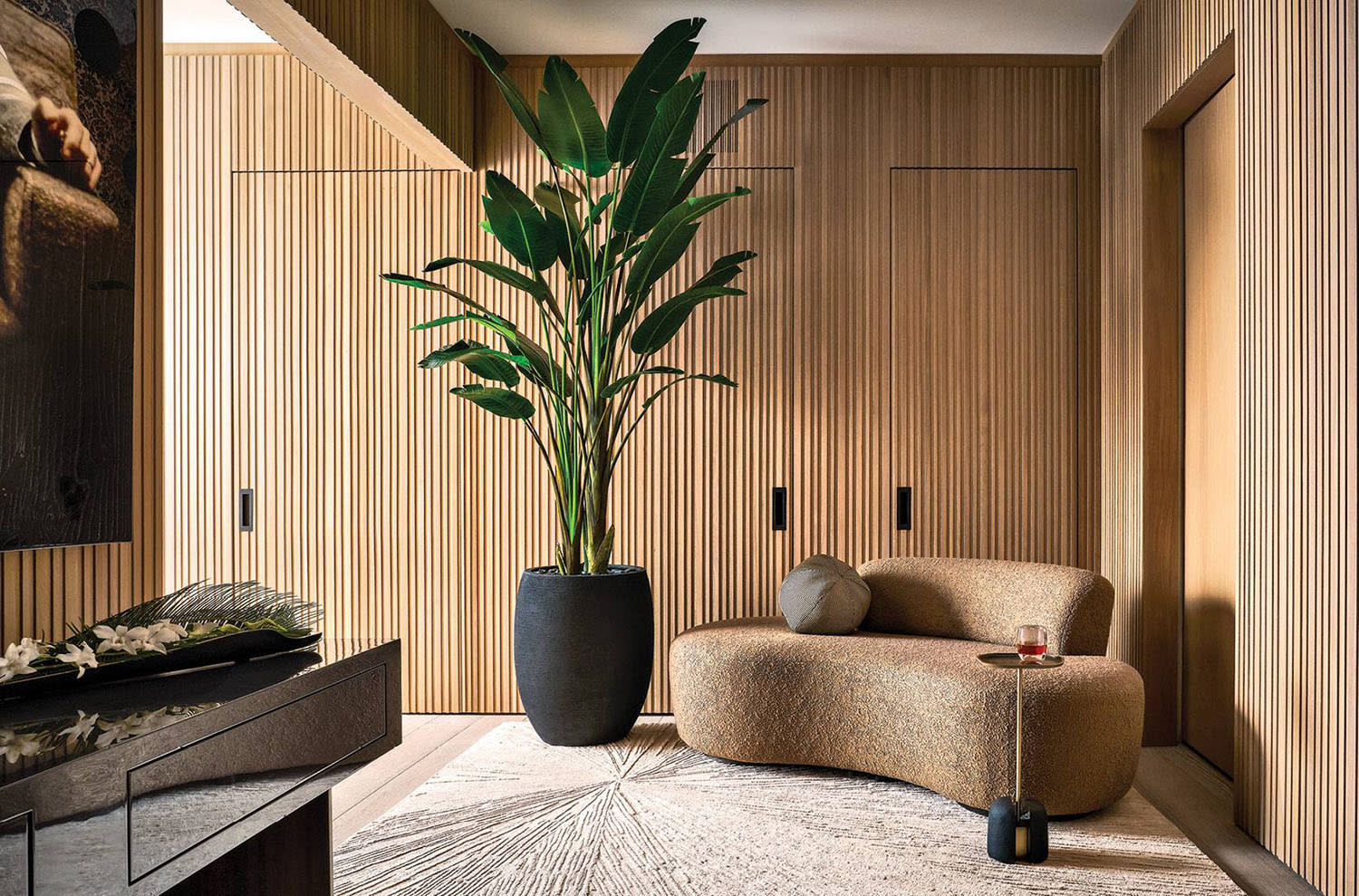slatted wood paneling wraps a foyer