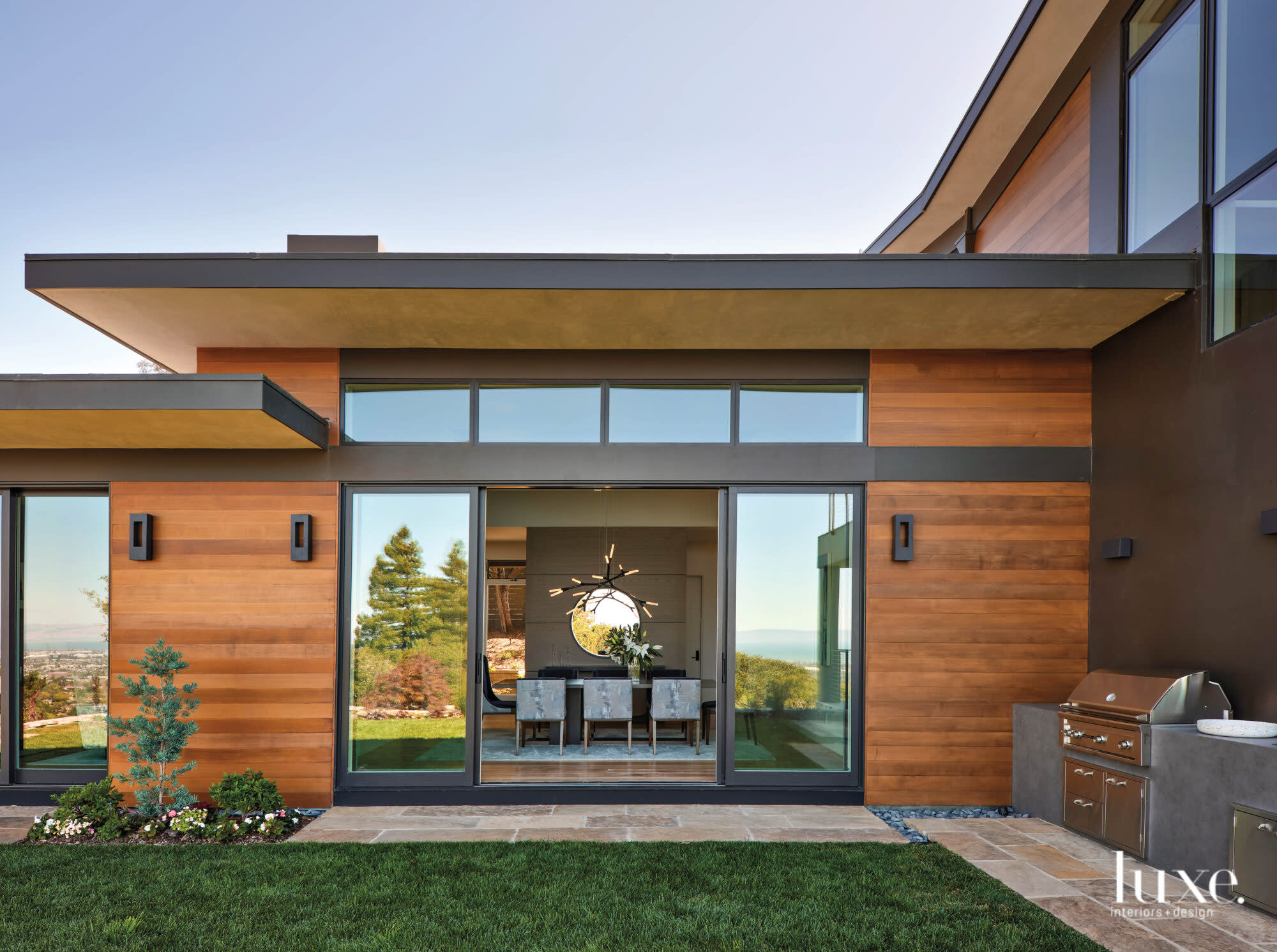 Looking through large sliding doors, you can see into the dining room.
