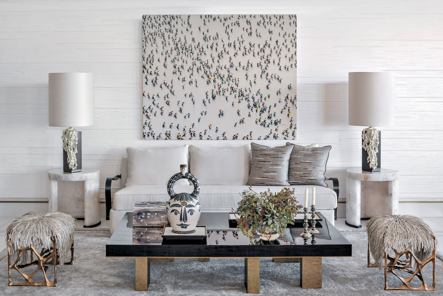 modern great room with large-scale artwork over white sofa and a rectangular coffee table