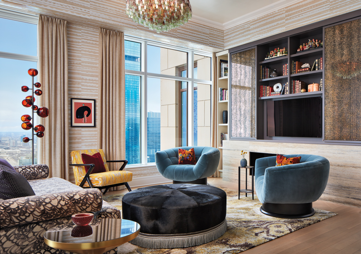 retro sitting room with travertine fireplace surround and blue velvet-covered swivel chairs.