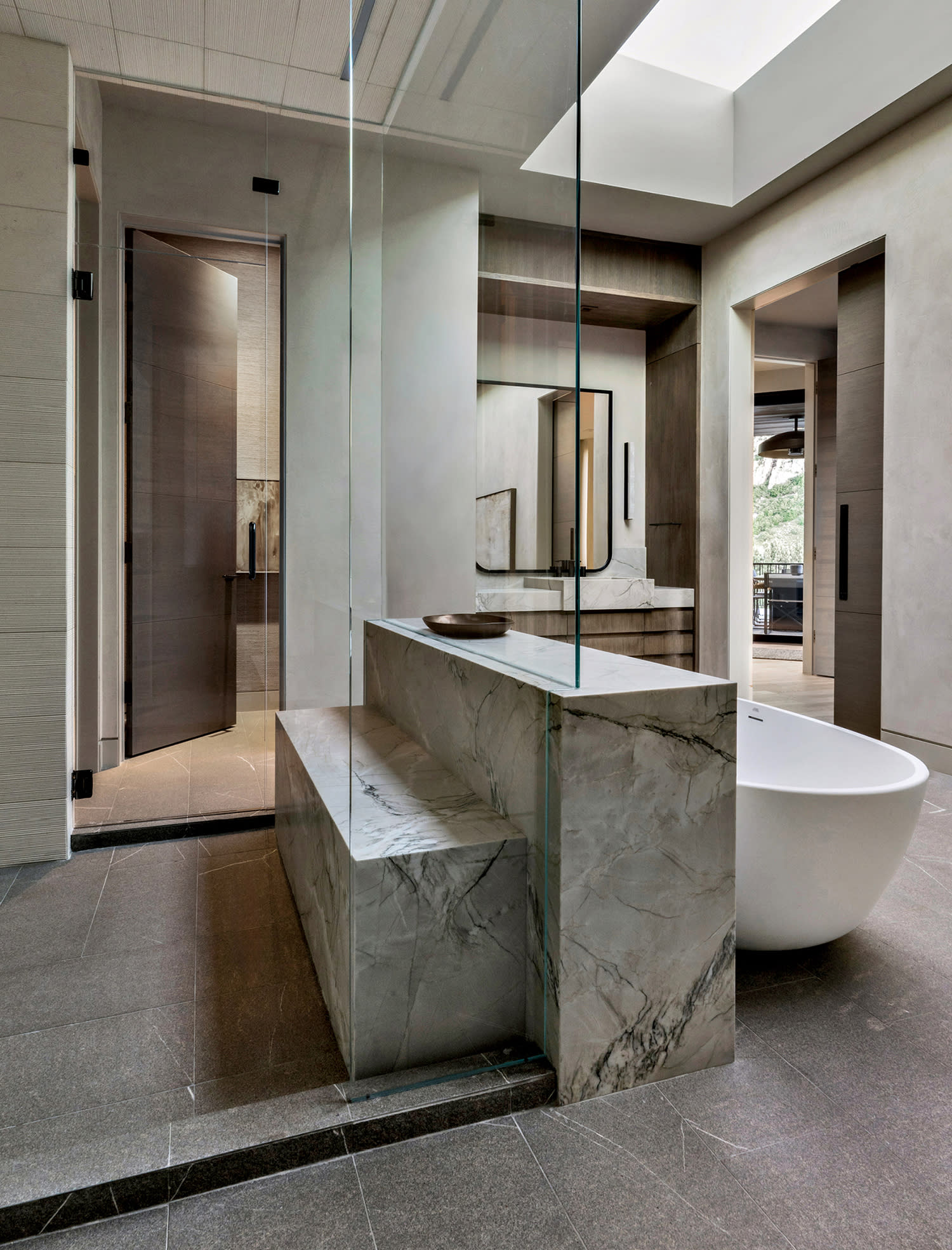 luxurious bathroom with a steam shower and tub