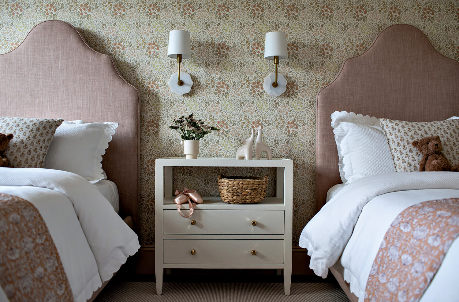 girl's bedroom with matching pink Serena & Lily beds and a vintage-inspired floral wallcovering