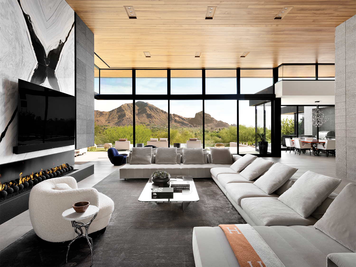 transitional living room with grey furnishings and a wood ceiling