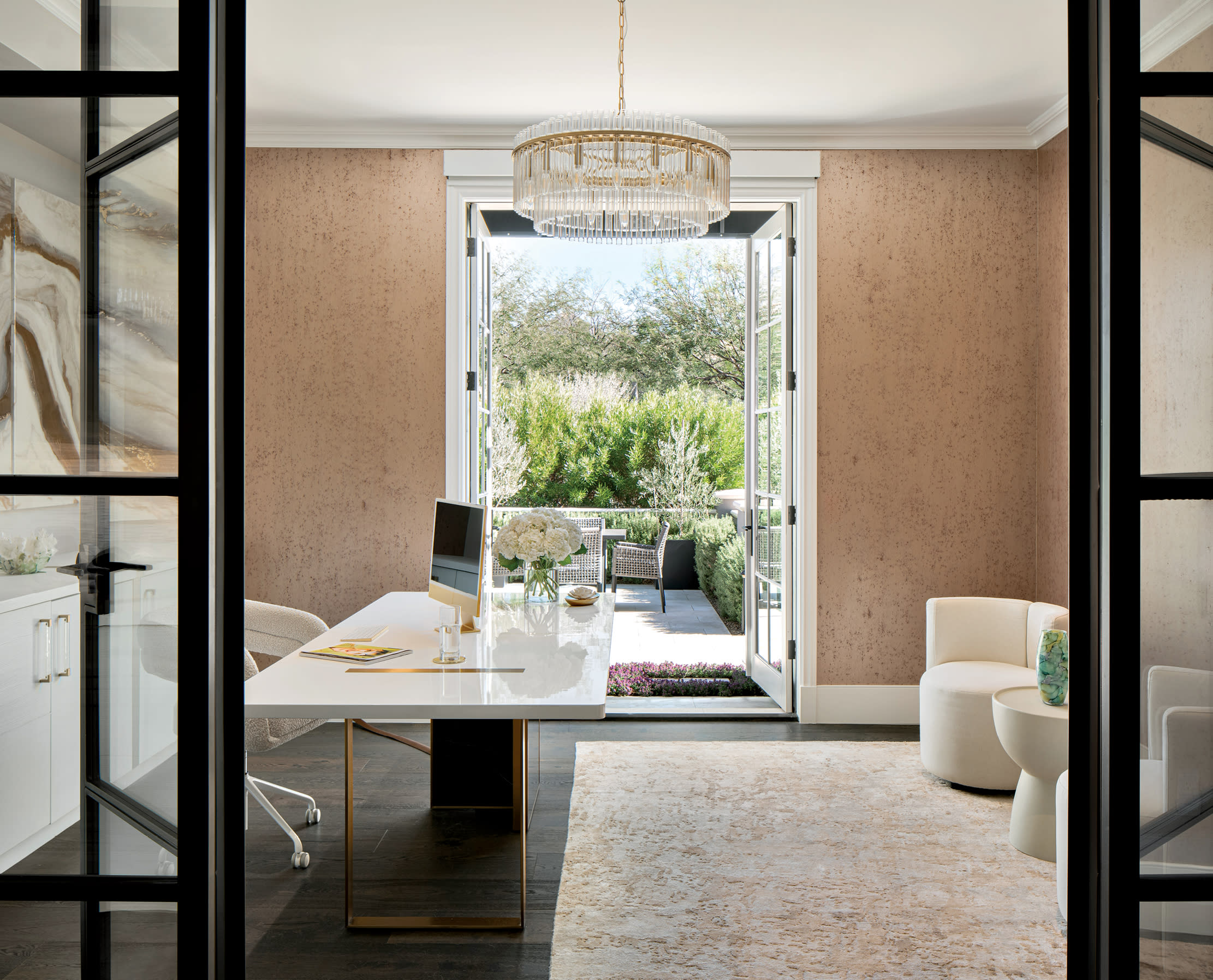 glam home office with a chandelier above the desk