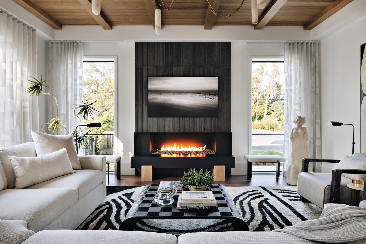 modern living room with a fire going in the fireplace