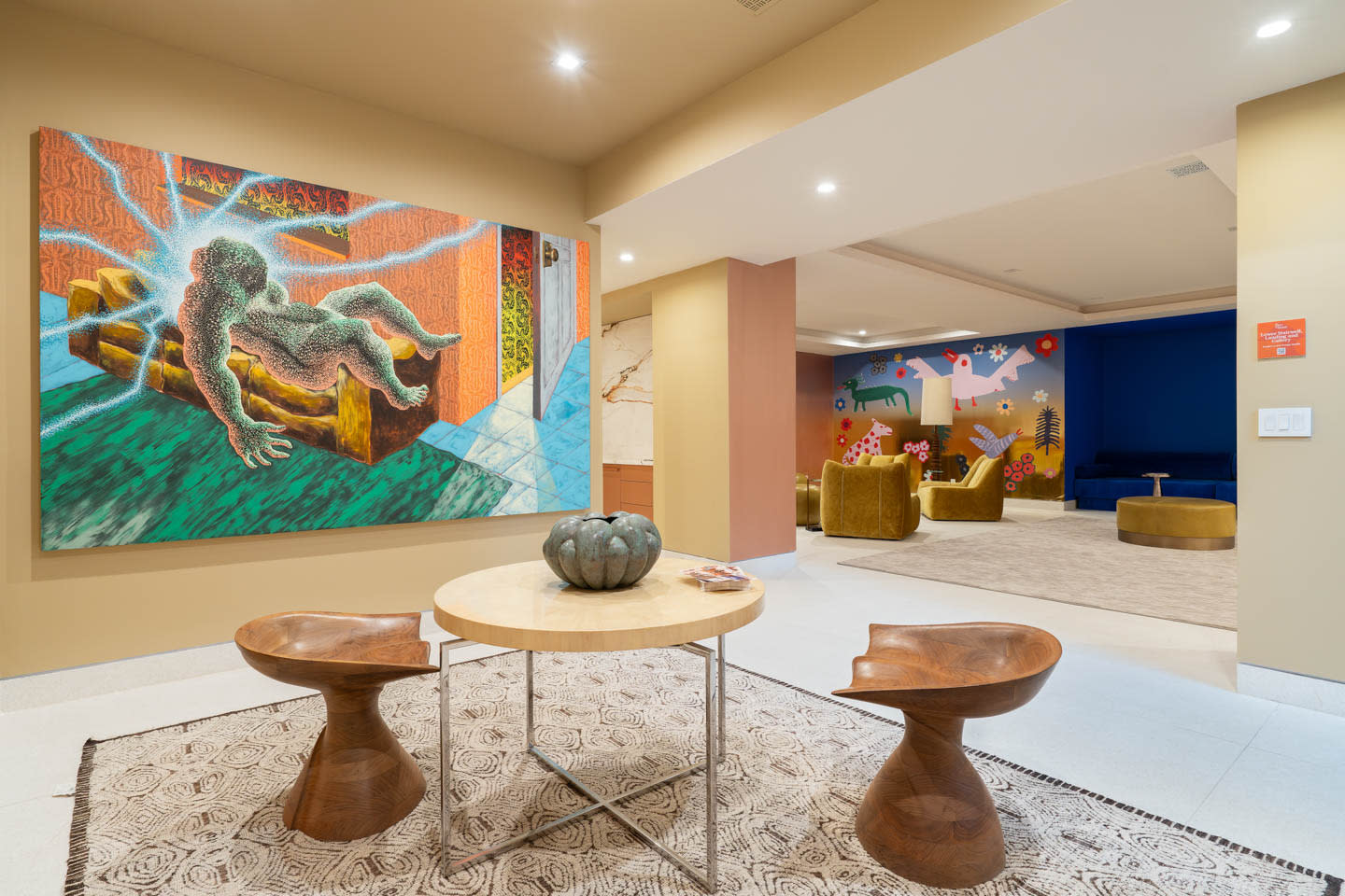 landing featuring contemporary artwork and a lounge beyond