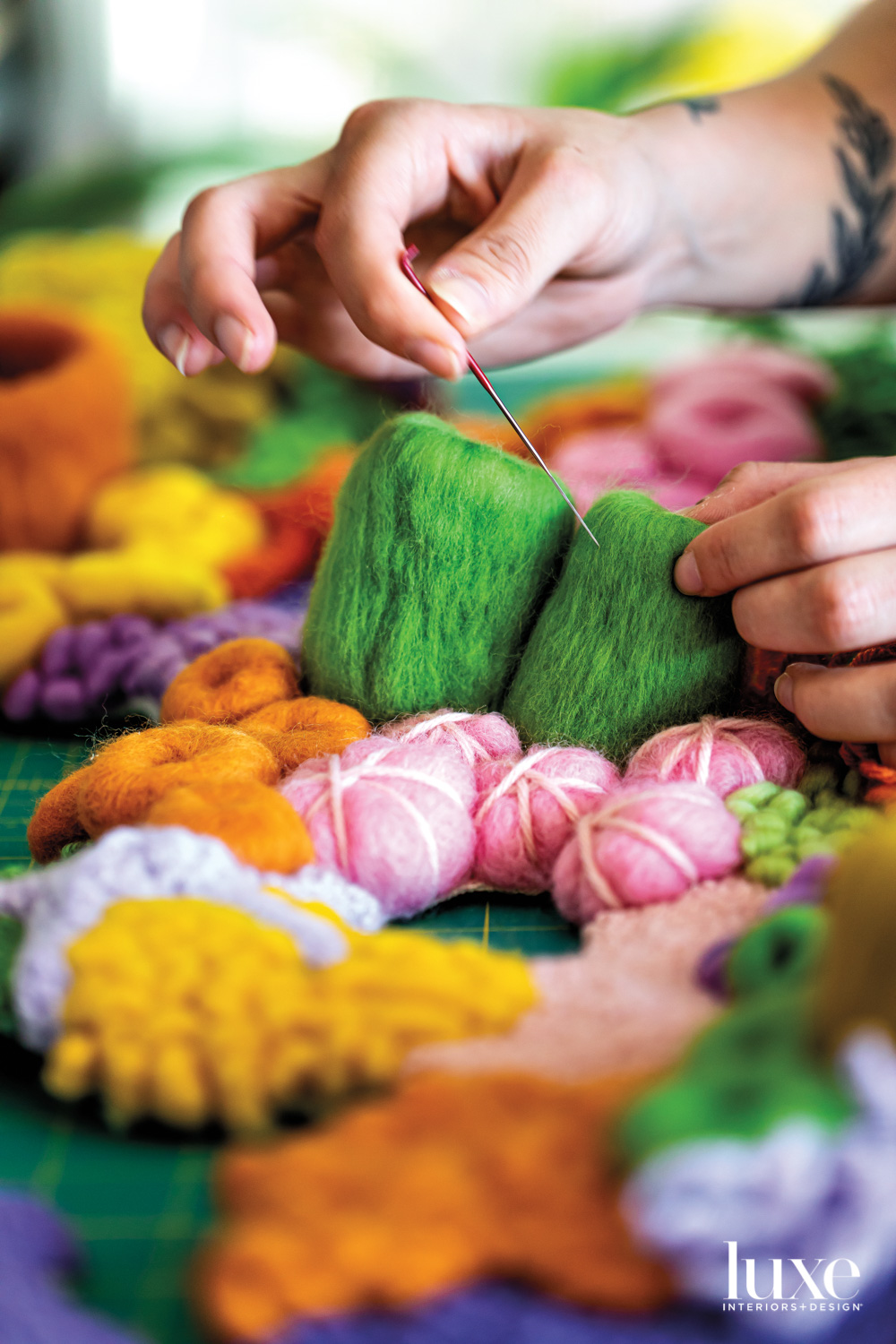 Murray holds a felting needle