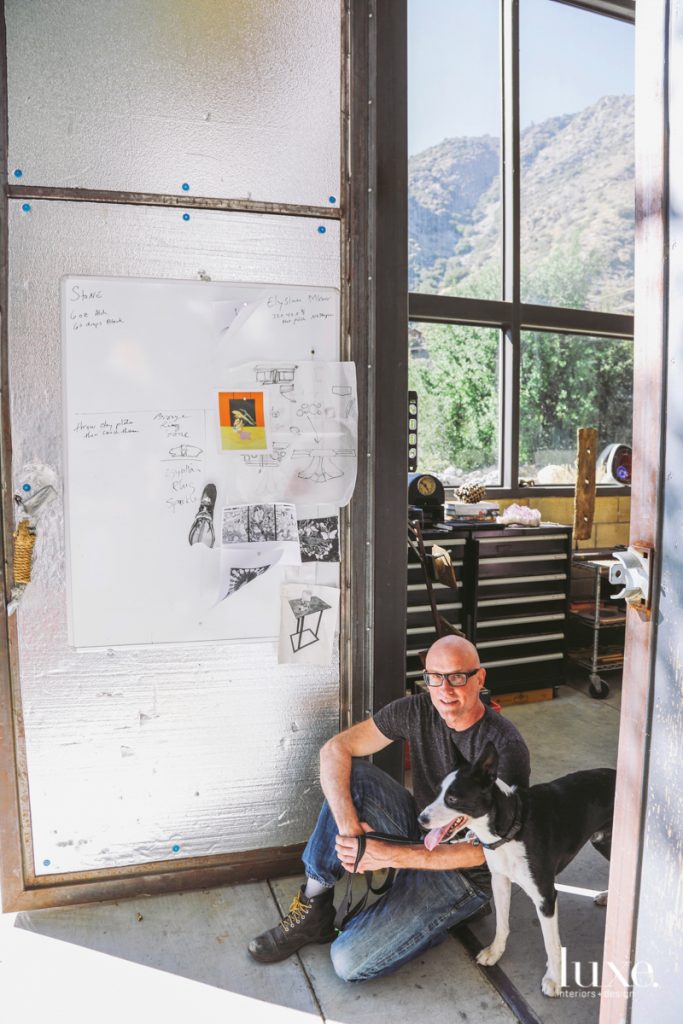 Chuck Moffit, with his dog, Elko, works out of a studio on Mount Baldy.