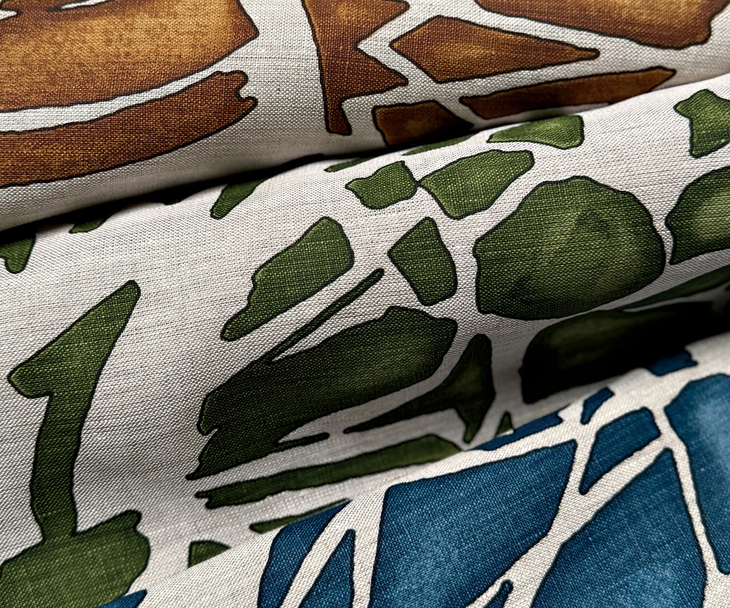 brown, green and blue abstract prints on a white background