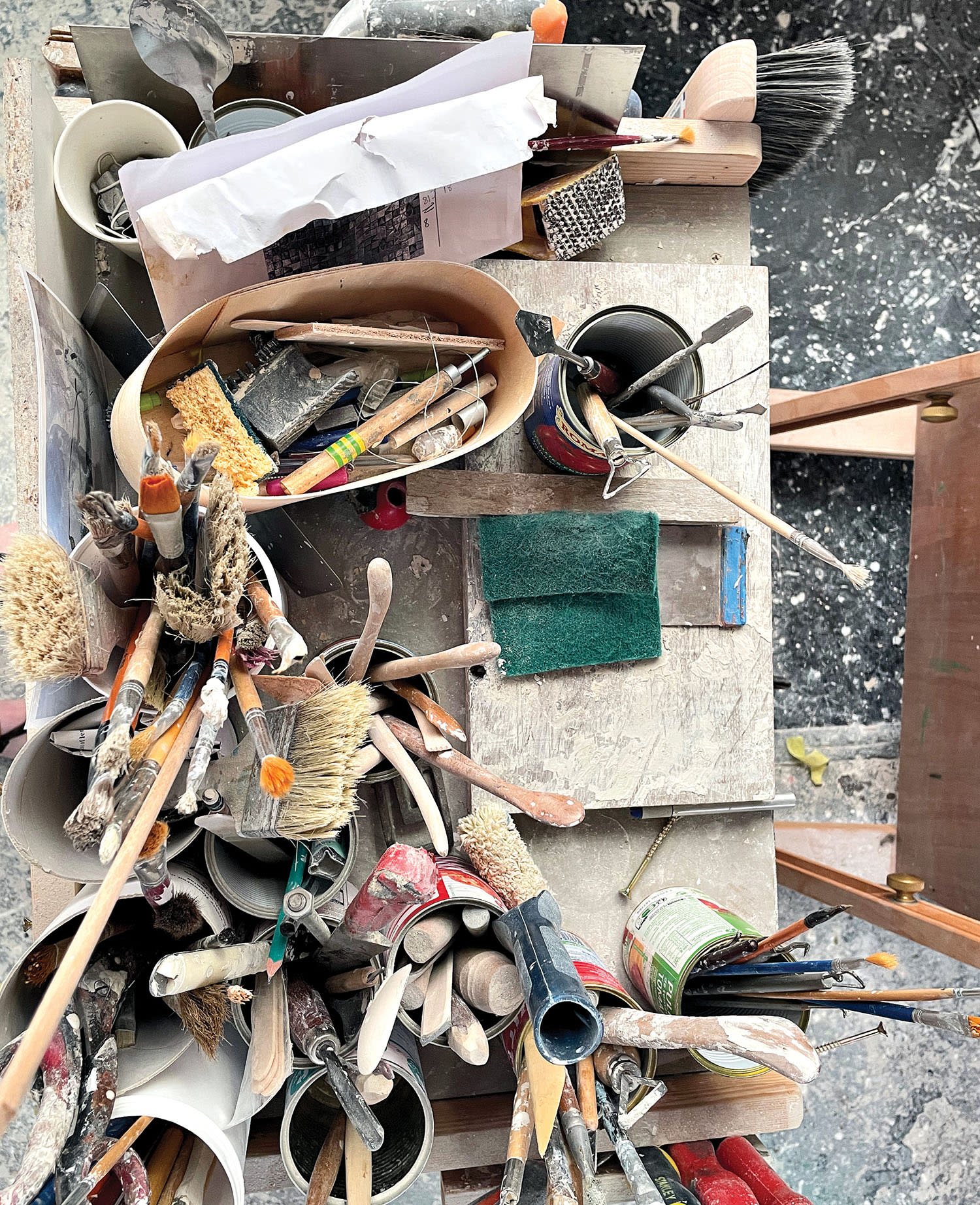 worktable of paintbrushes and art tools