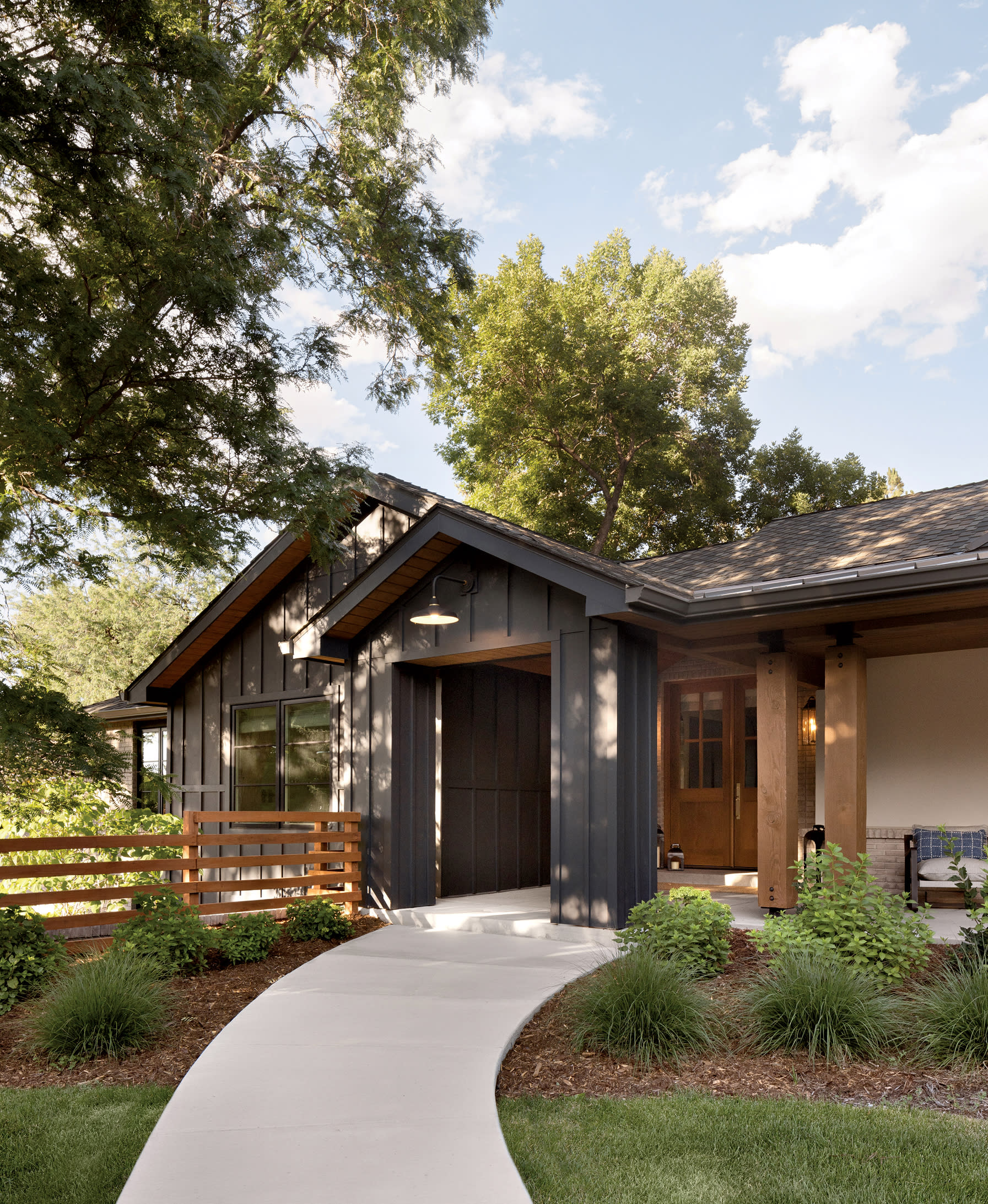 exterior of a Colorado home with board-and-batten wood siding in a dark stain