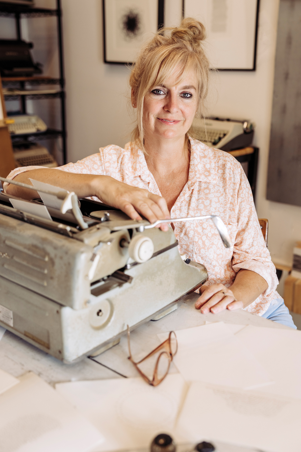 artist sitting with a typewriter