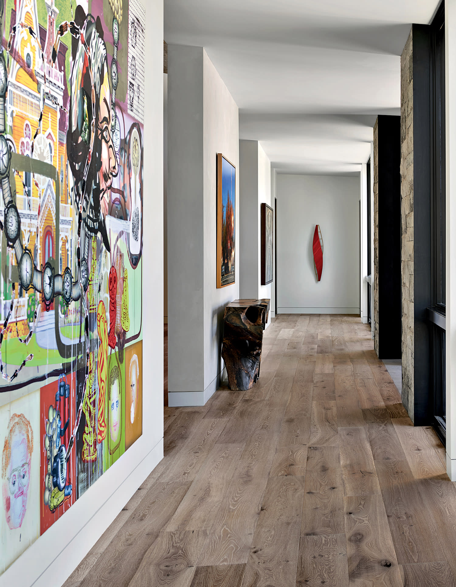 gallery hall off an entryway with a vibrant large-scale piece by Drew Beattie and Daniel Davidson