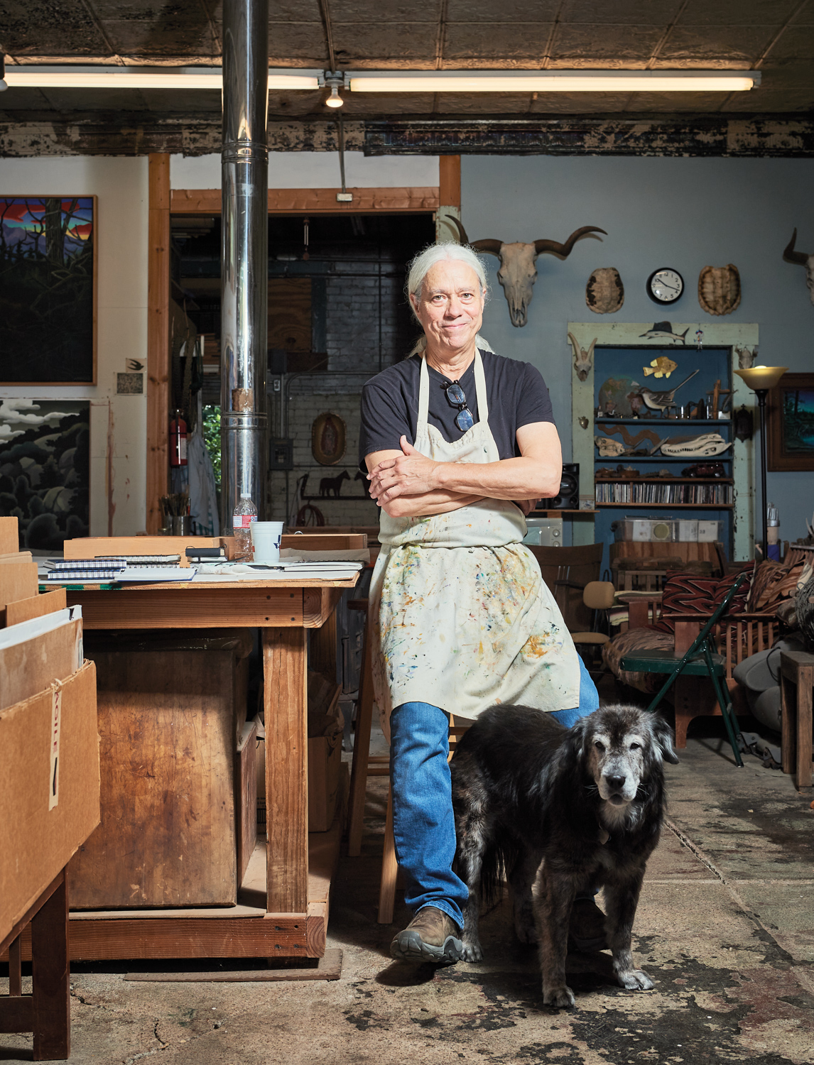 artist and his dog in a studio