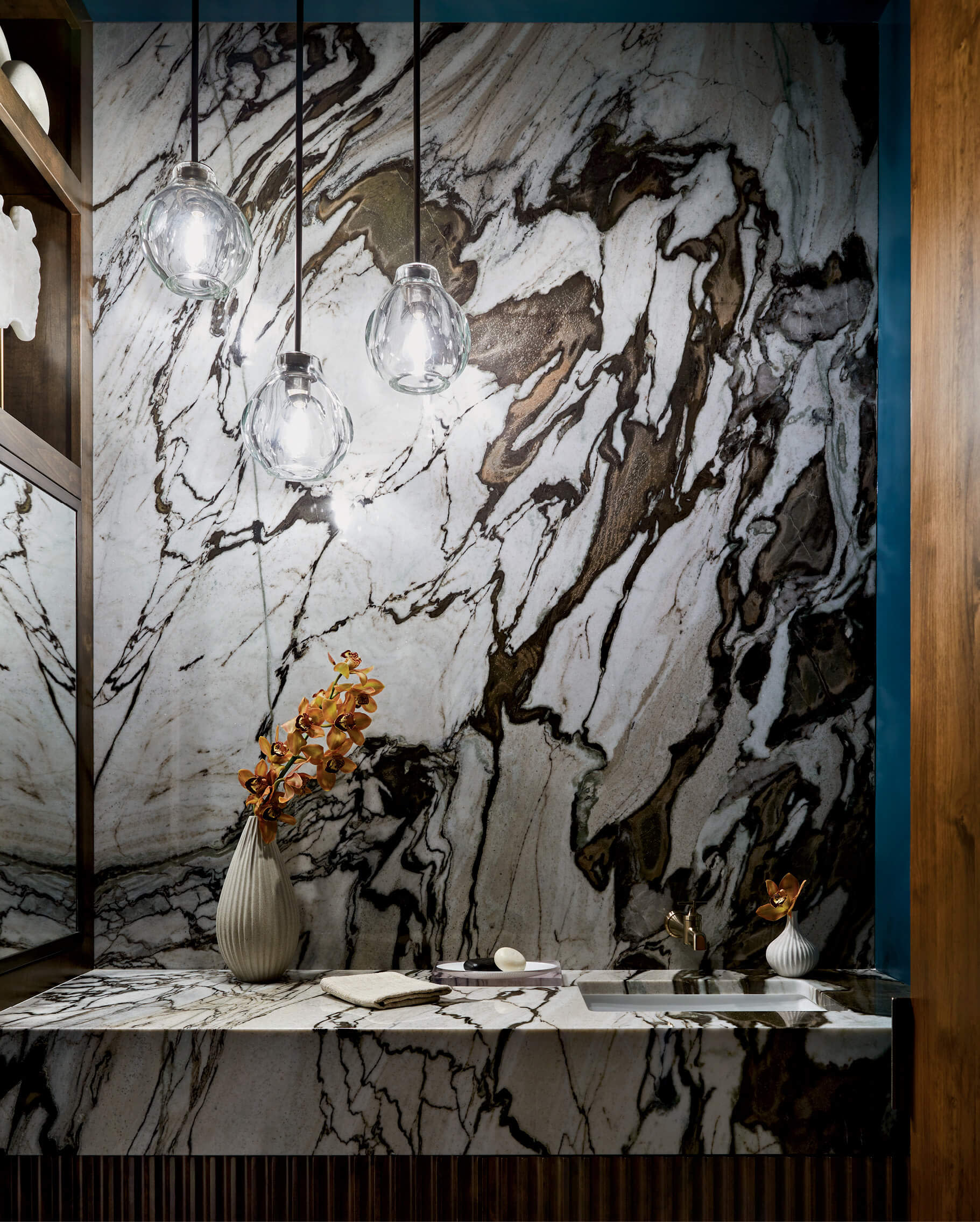 powder room covered in stately brown and grey marble