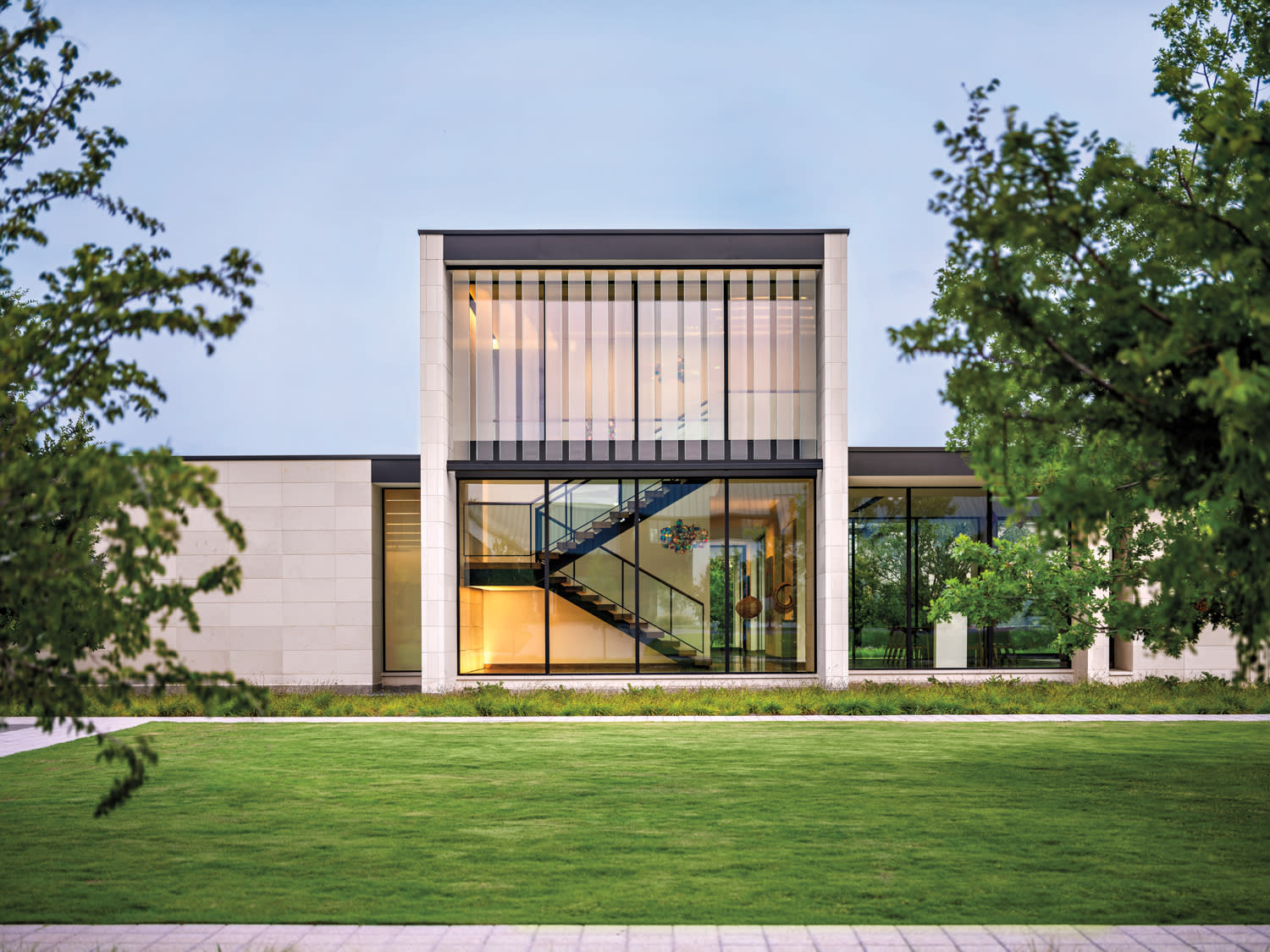 modern home exterior showcasing expansive windows