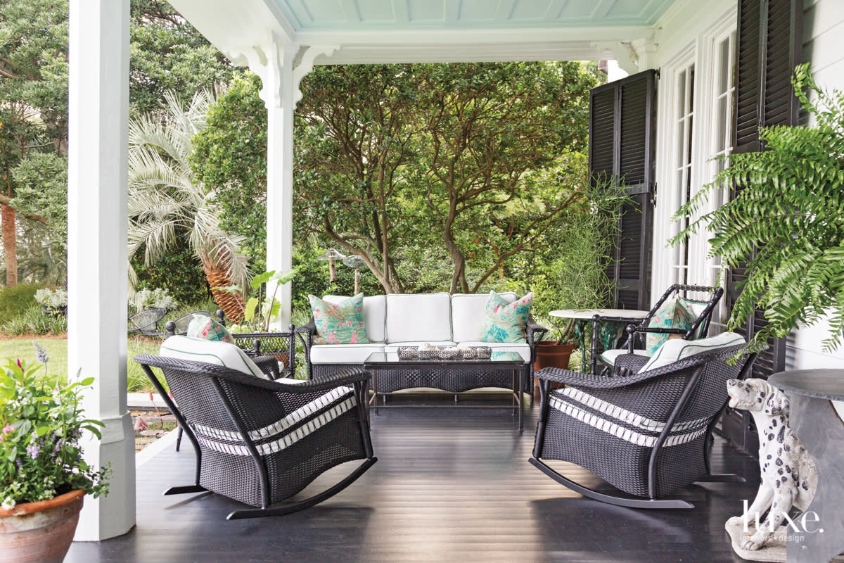 porch with black wicker furniture