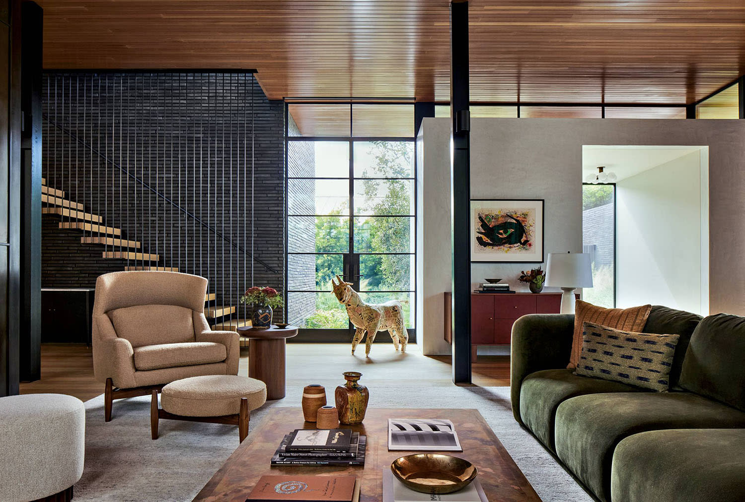 contemporary living room with traditional furnishings and an animal sculpture