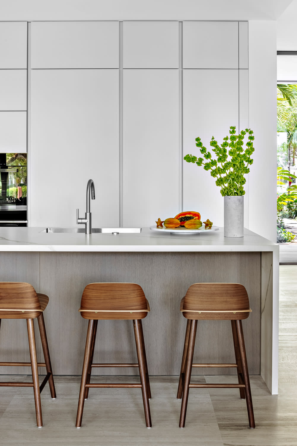 minimalist kitchen with wood, marble and concrete materials