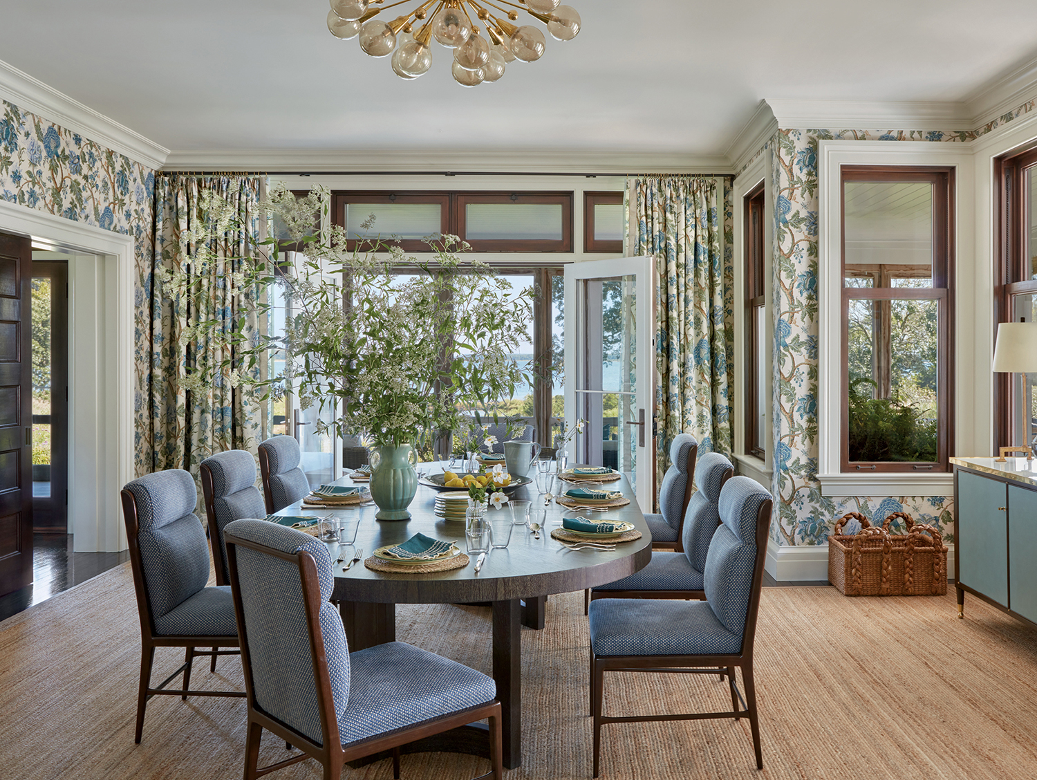 classic dining room with blue and white floral wallpaper