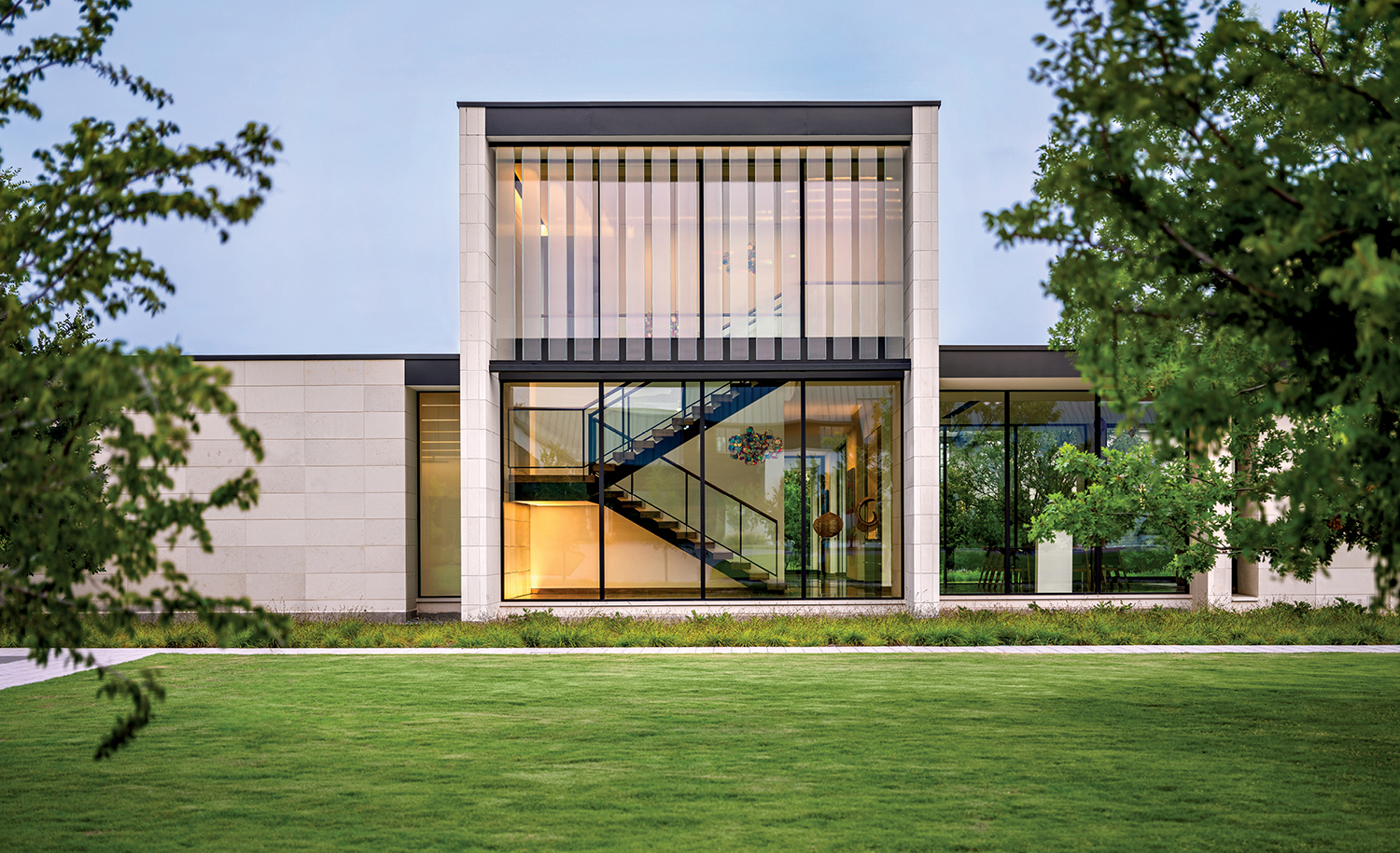limestone and glass exterior of a modern Dallas home