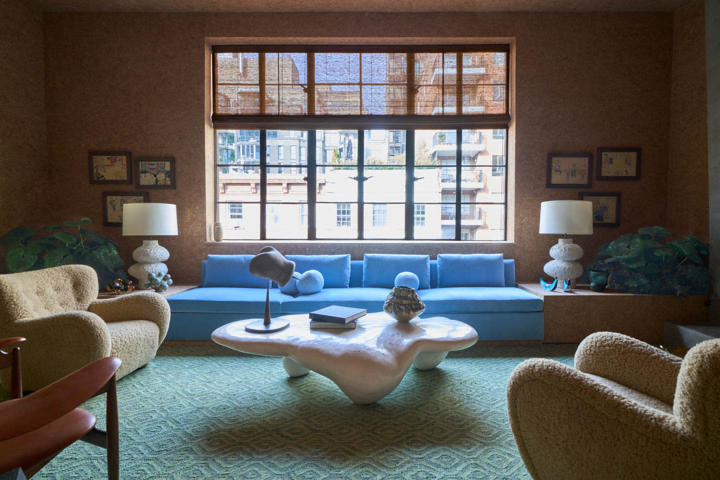 modern organic loft with a blue couch and a white coffee table