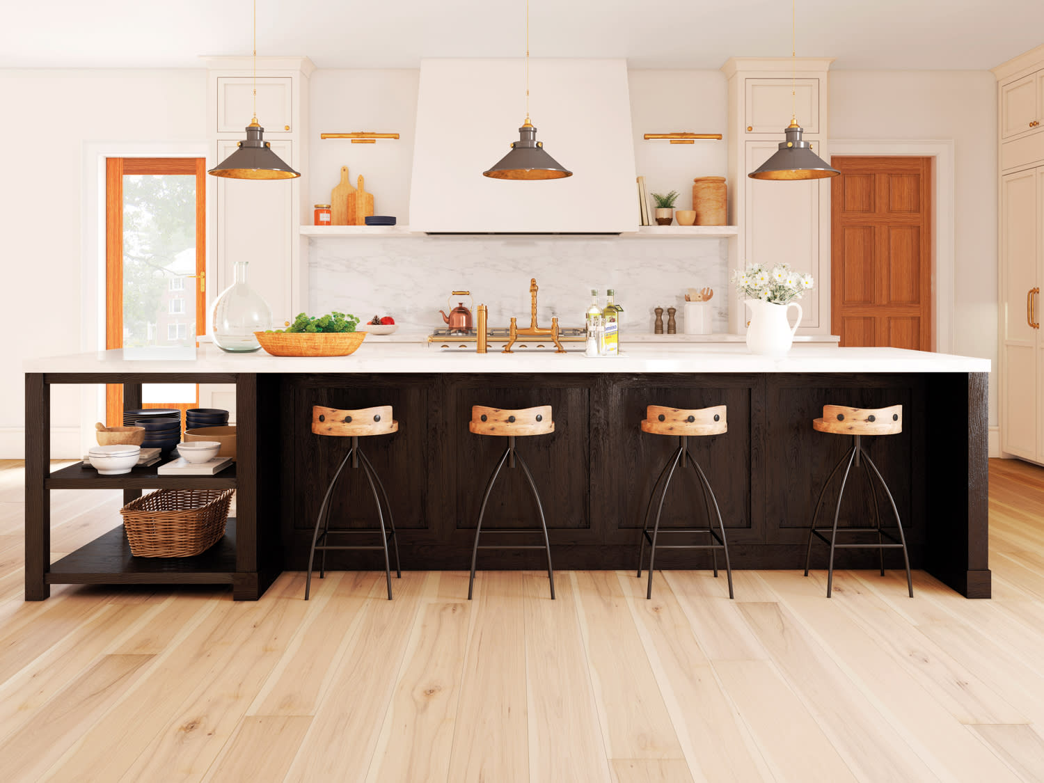 Kitchen with light wood floors, black island and white countertops