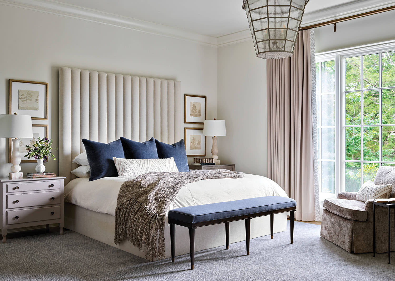 contemporary bedroom with a white channeled headboard 