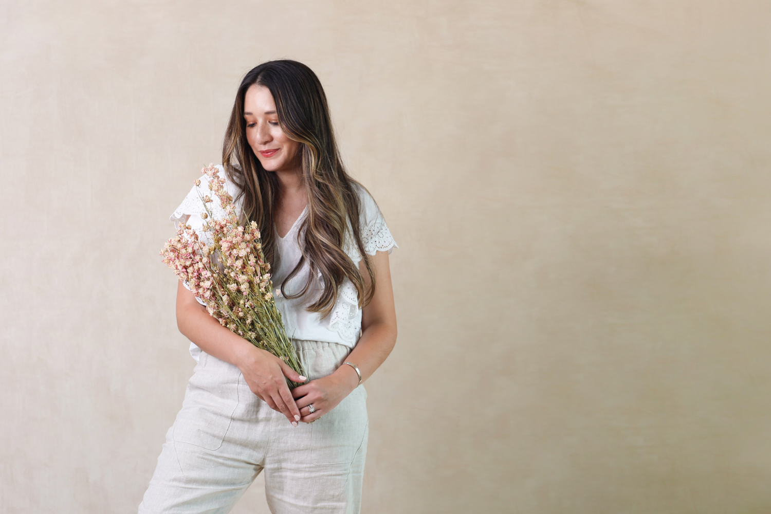 Jasmyn Marie Maciel holding a bouquet of flowers