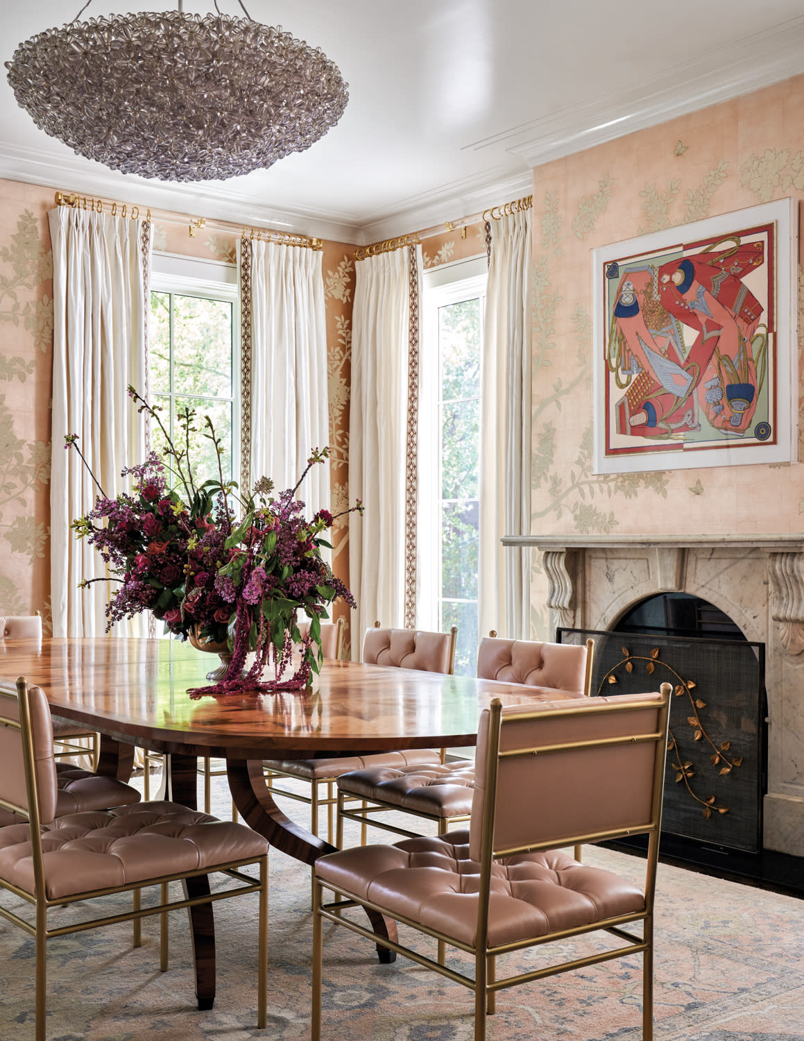 dining room featuring pink hand-painted wallpaper