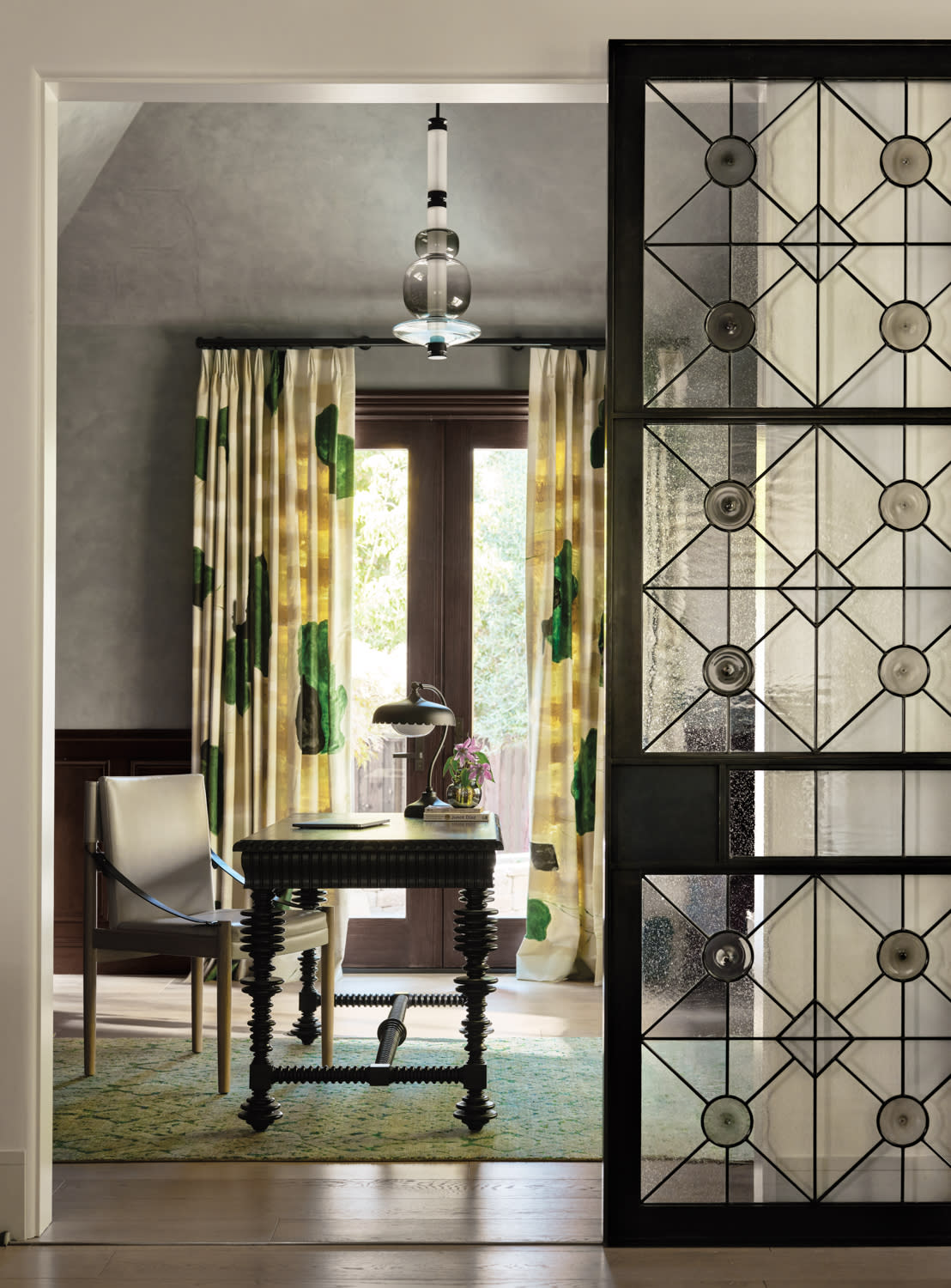 modern home office with a stained glass door
