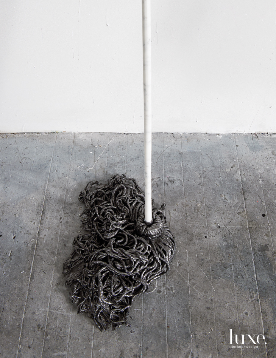 The marble-handled hardened mop is part of Seiden's "Invisible Labor" series.