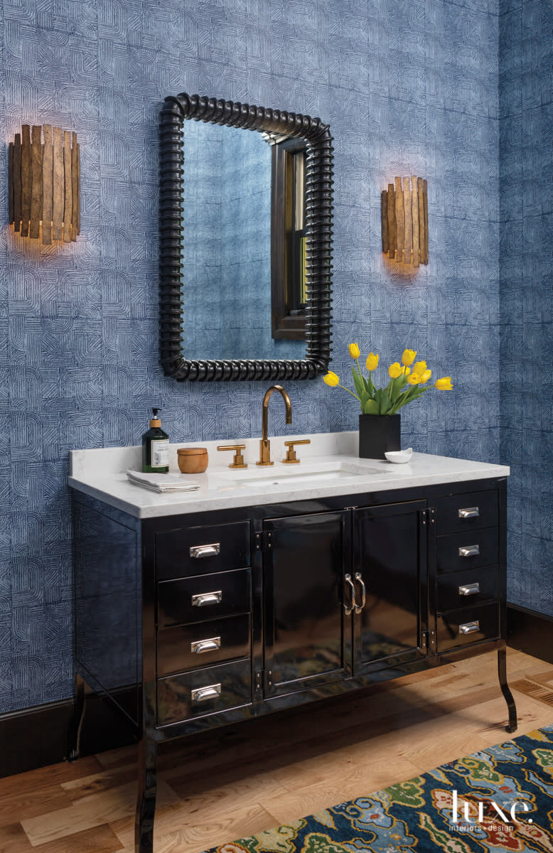 blue powder room with patterned wallcovering