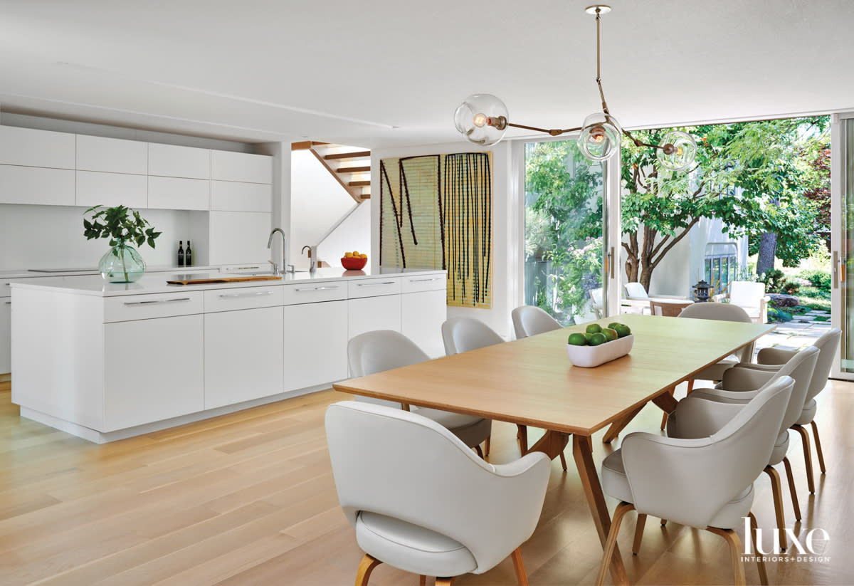 modern white organic kitchen with wood floors designed by Mosaic Architects + Interiors