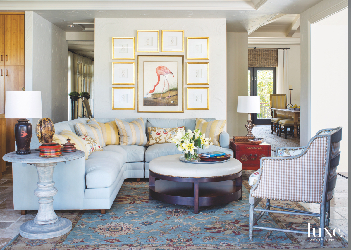 traditional living room sitting area yellow pillows and frames