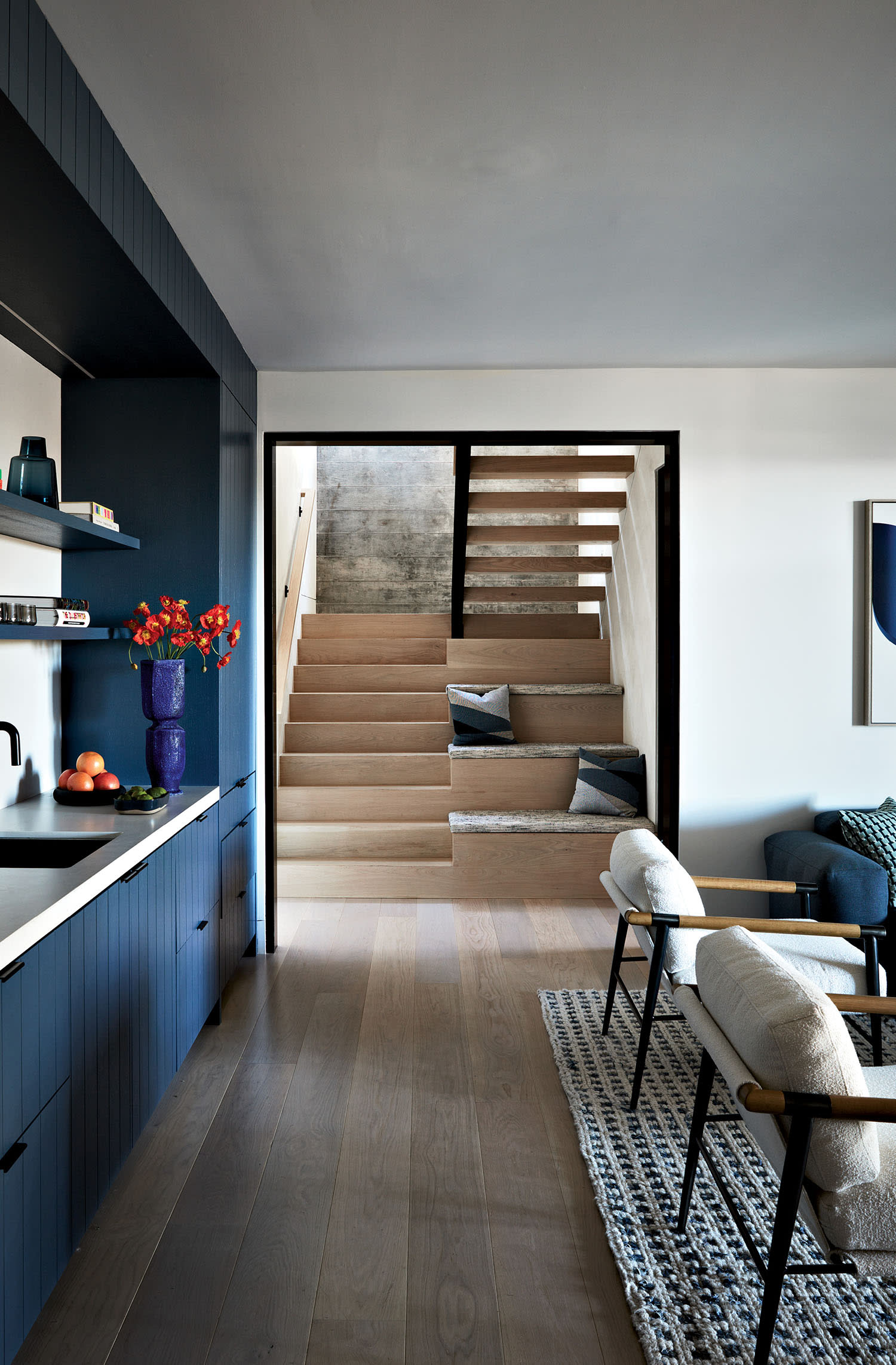 contemporary family room with a blue niche 