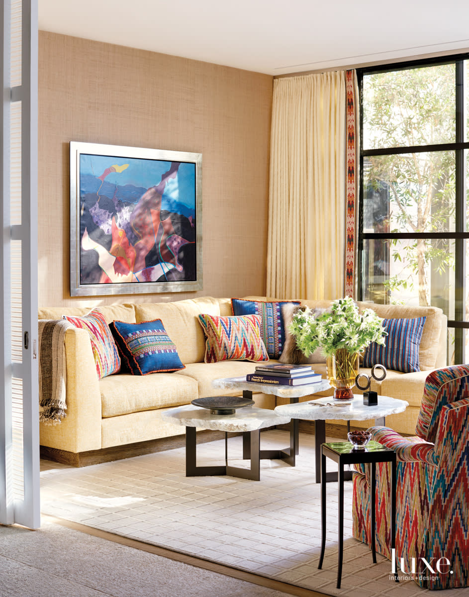 Rancho mirage den with yellow sectional and grass cloth walls
