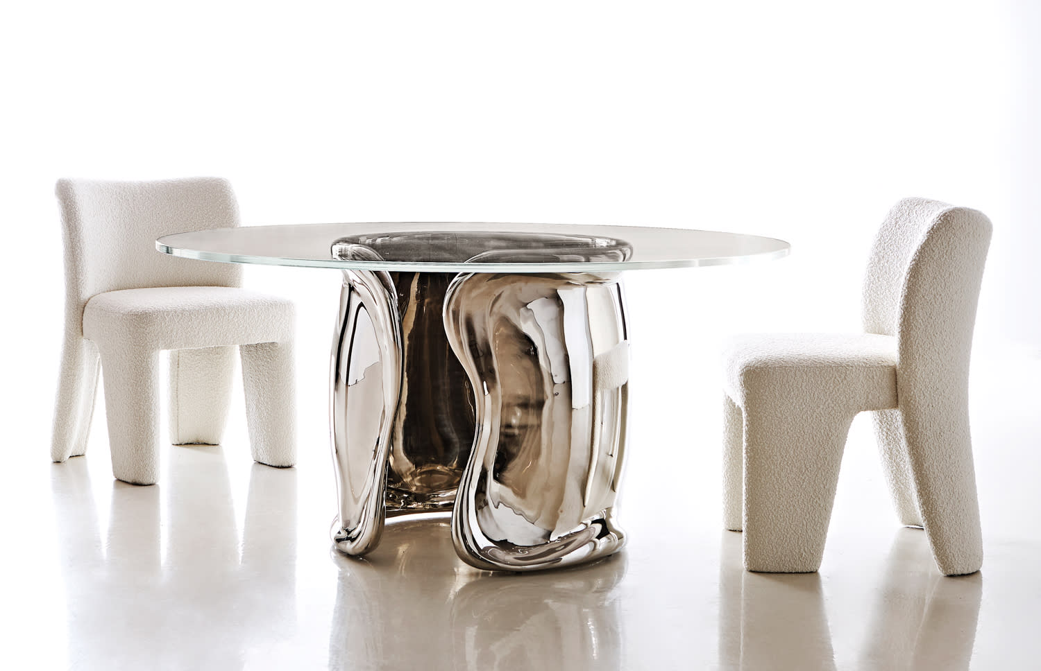 dining table made of a stainless steel base and glass top