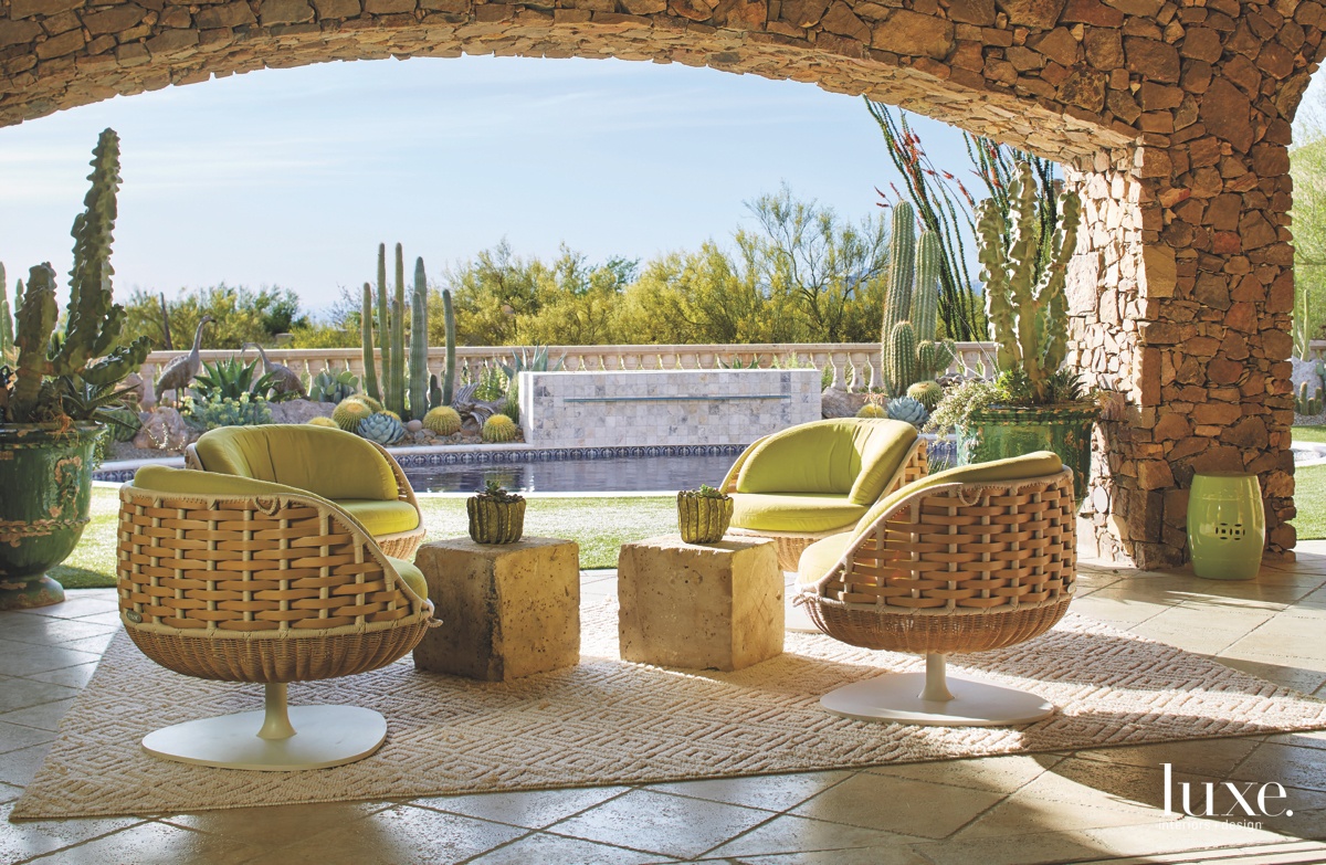 traditional outdoor seating woven chairs green cushions pool infuse
