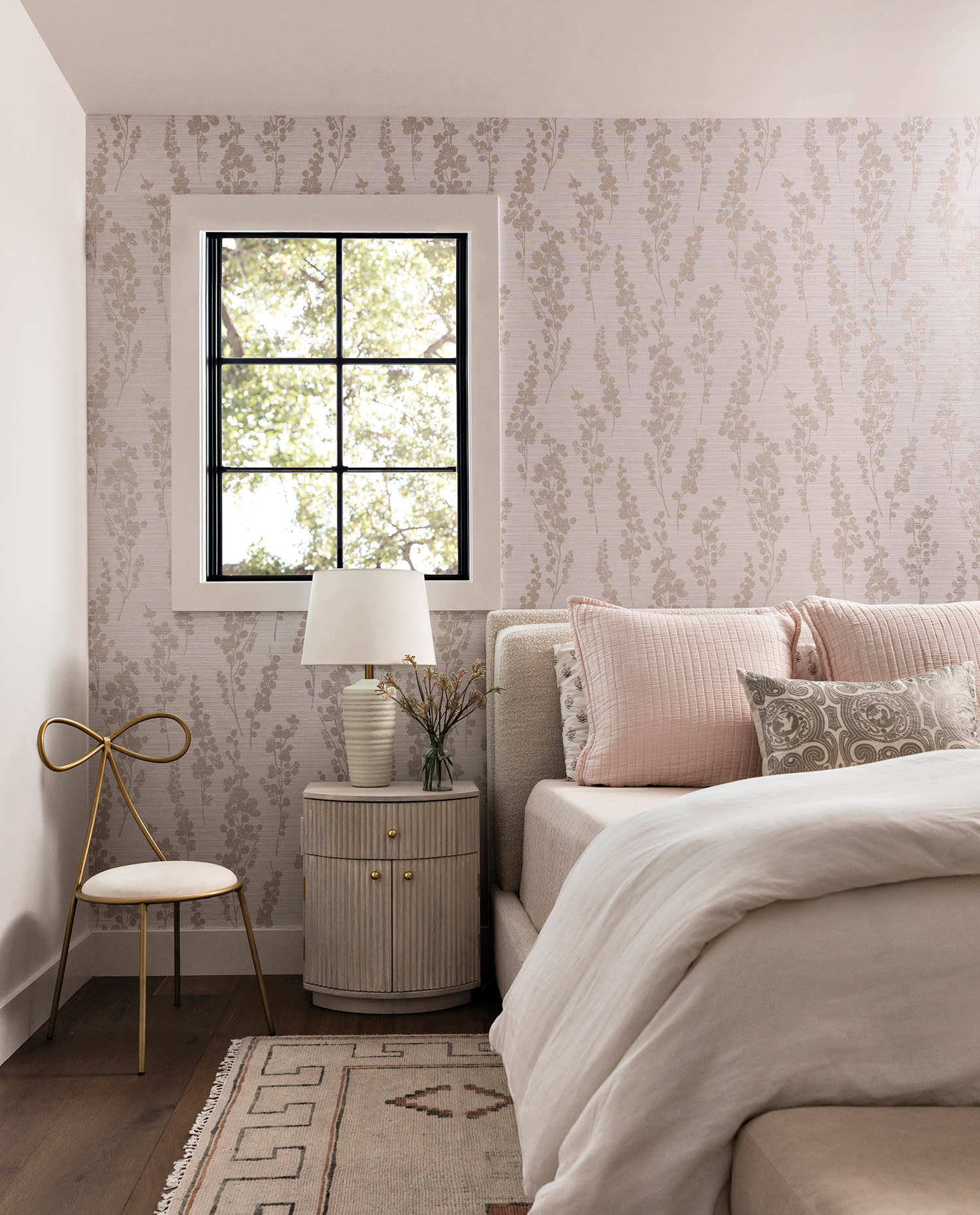 contemporary bedroom with a pink floral wallpaper