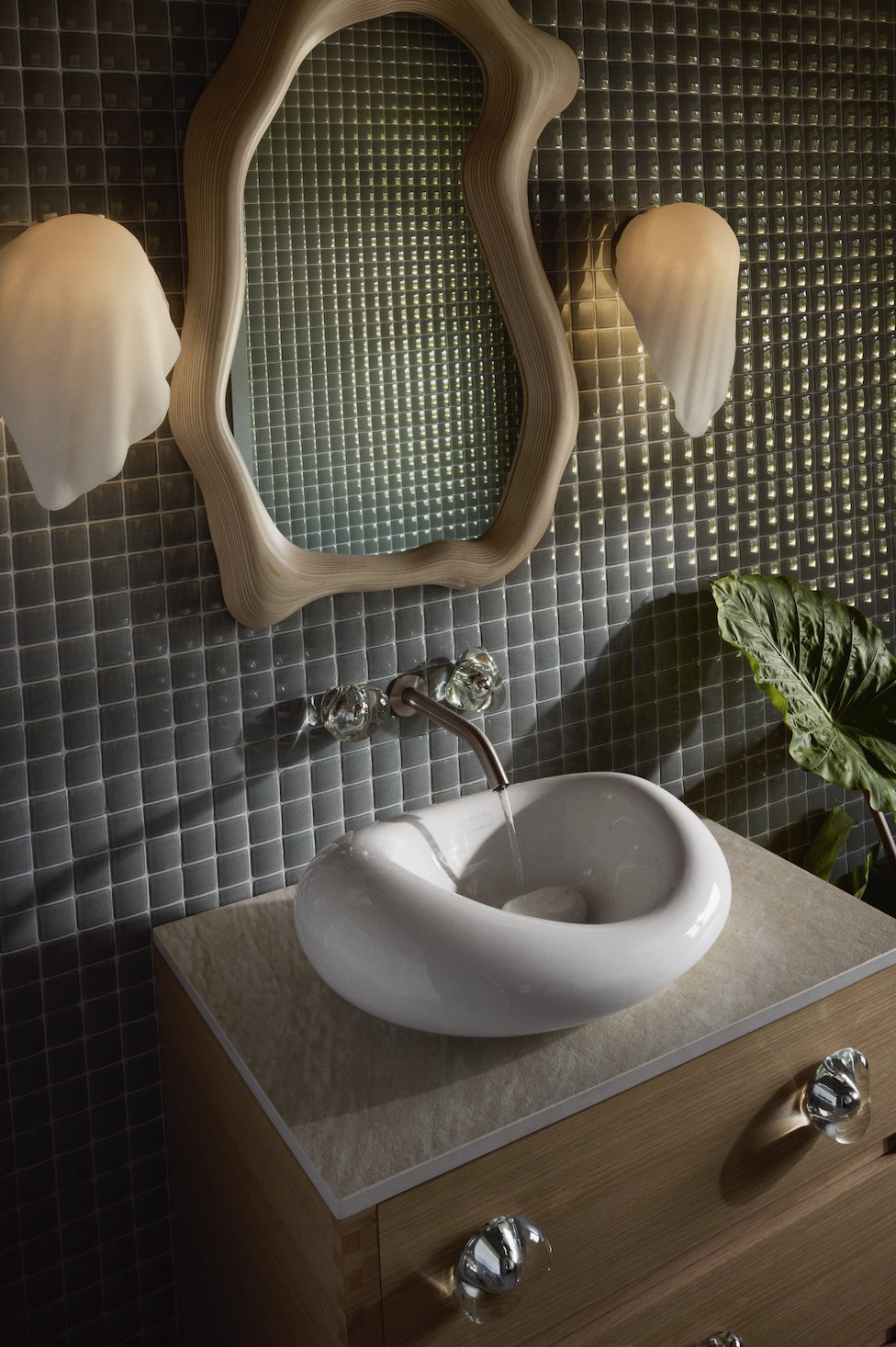 amorphous shaped mirror above a bulbous sink