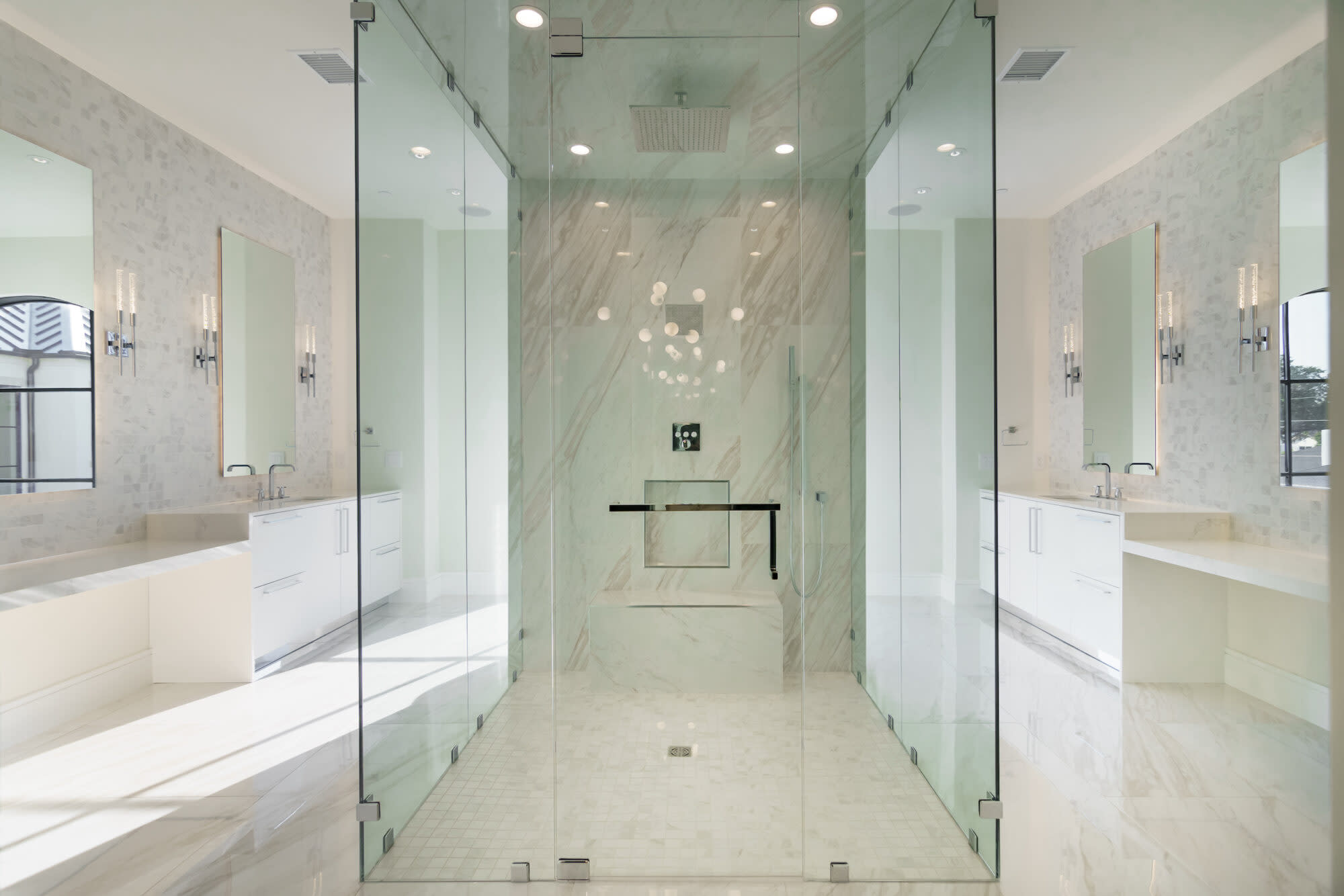 A spacious bathroom featuring a glass shower door.